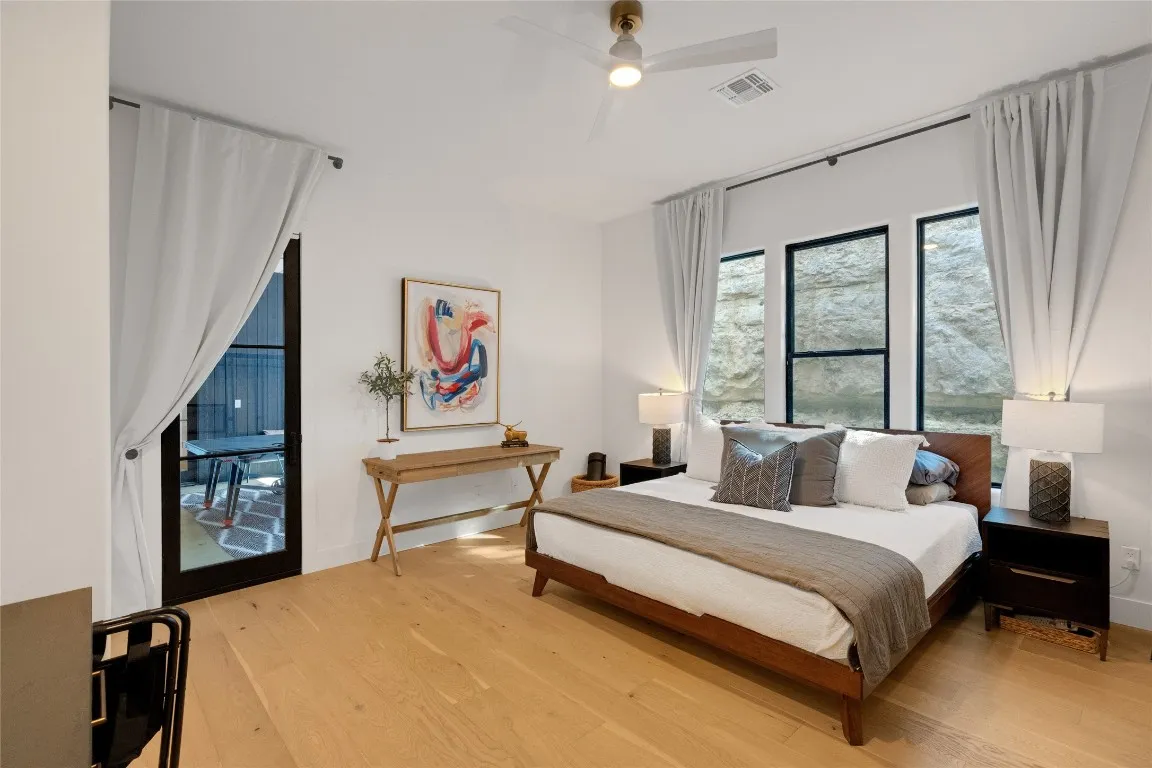 a bathroom with a bathtub a shower and vanity