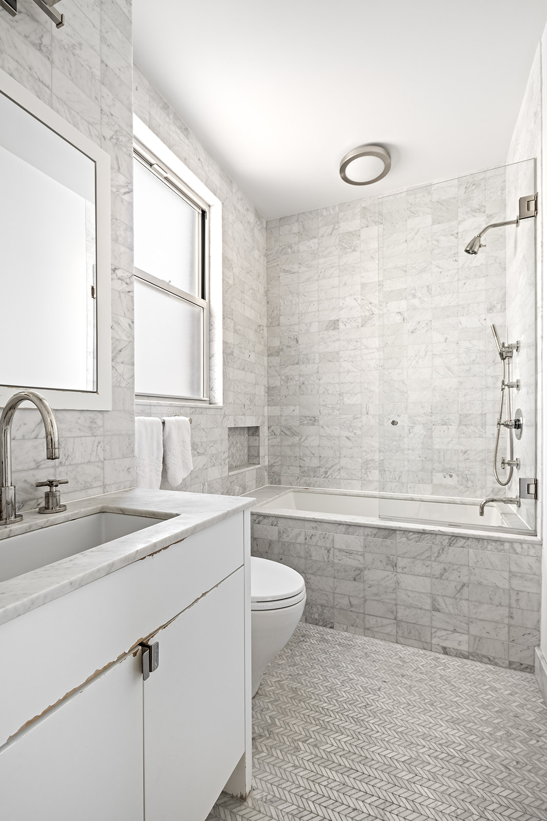 969 Park Avenue, Unit PHB Manhattan, NY 10028 - Photo 6 of 9 a bathroom with a sink a toilet and shower