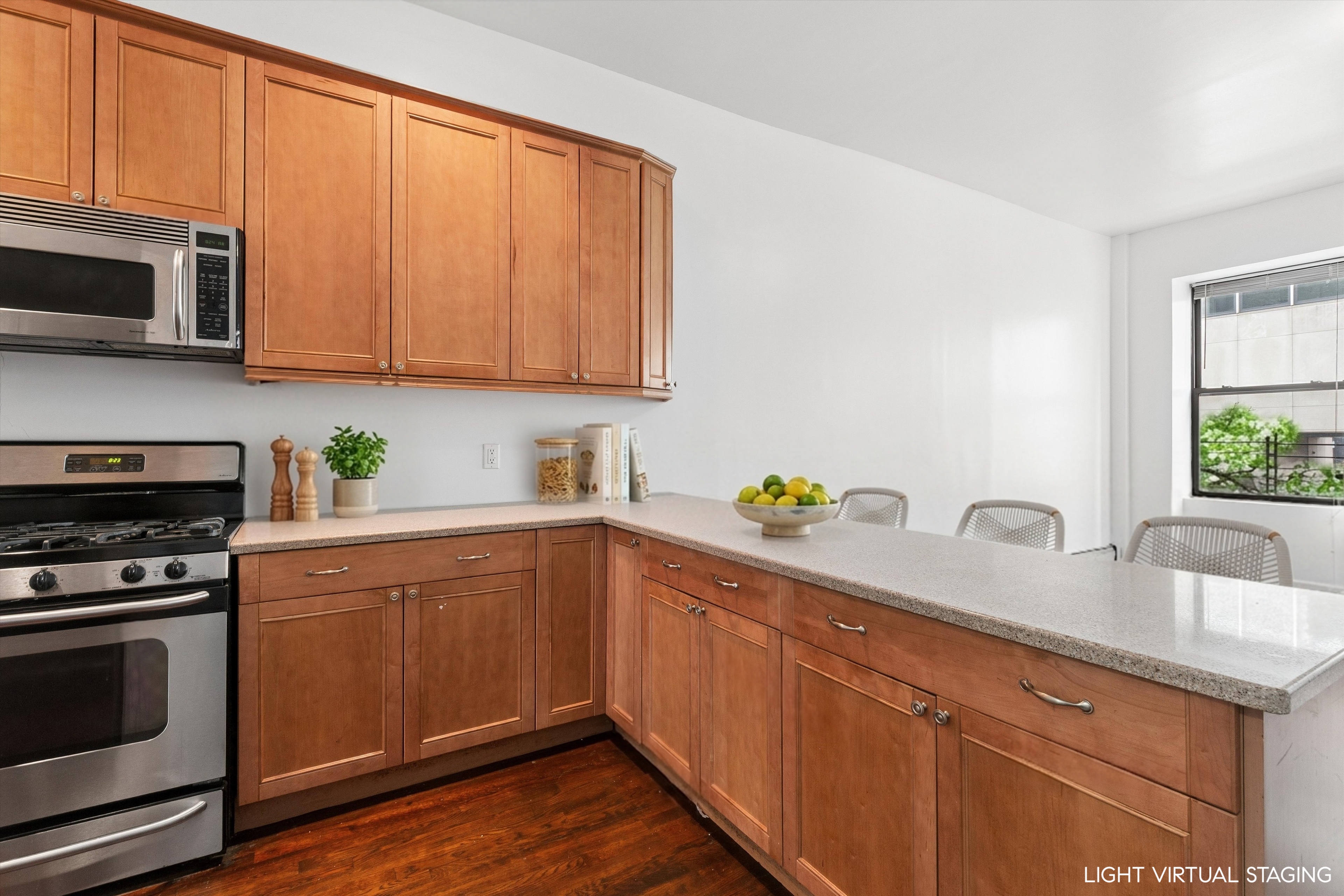 165 West 126th Street Manhattan, NY 10027 - Photo 23 of 40 a kitchen with stainless steel appliances granite countertop a sink a stove a microwave oven cabinets and a counter space