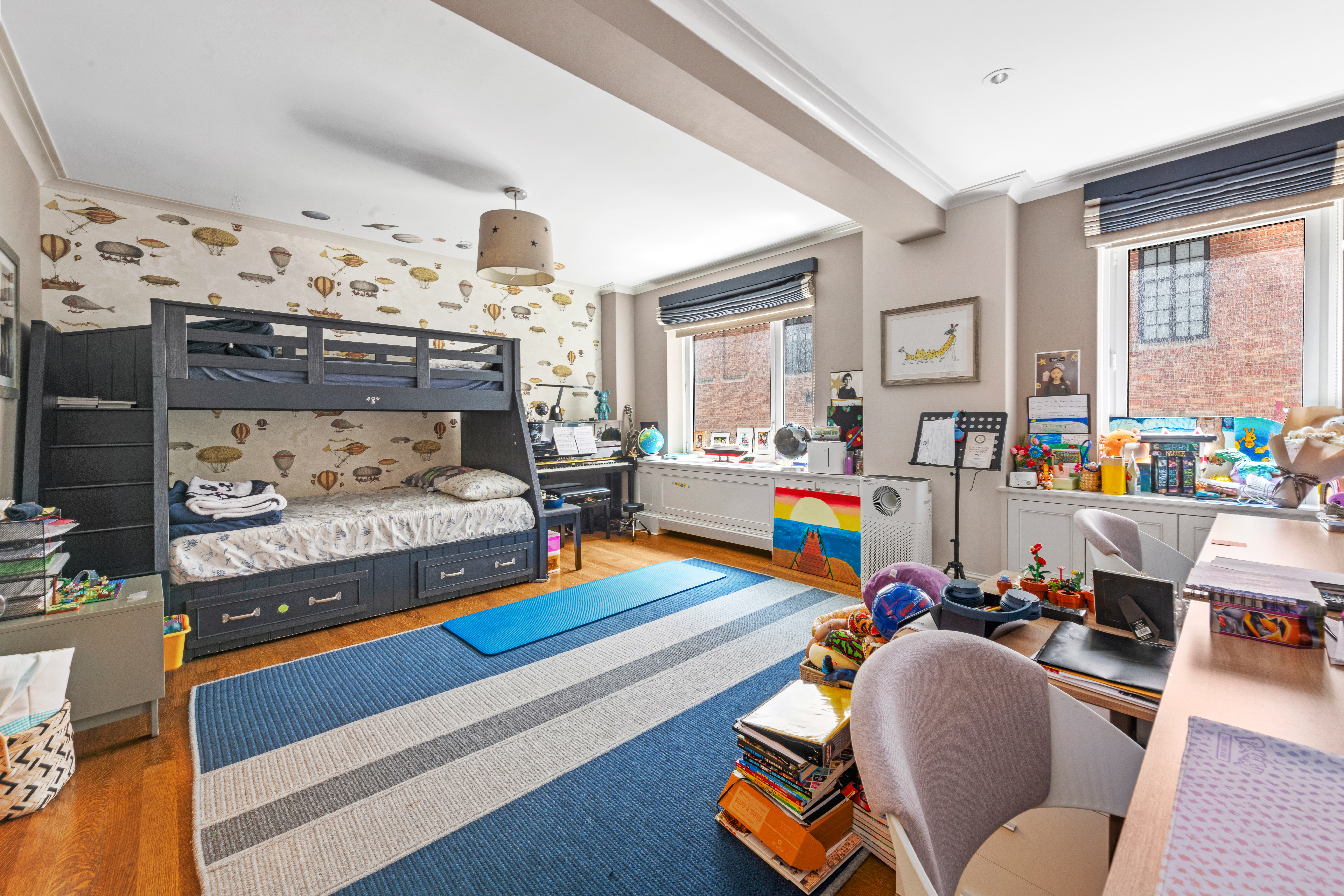 530 Park Avenue, Unit 3F Manhattan, NY 10065 - Photo 12 of 25 a living room with furniture and a wooden floor