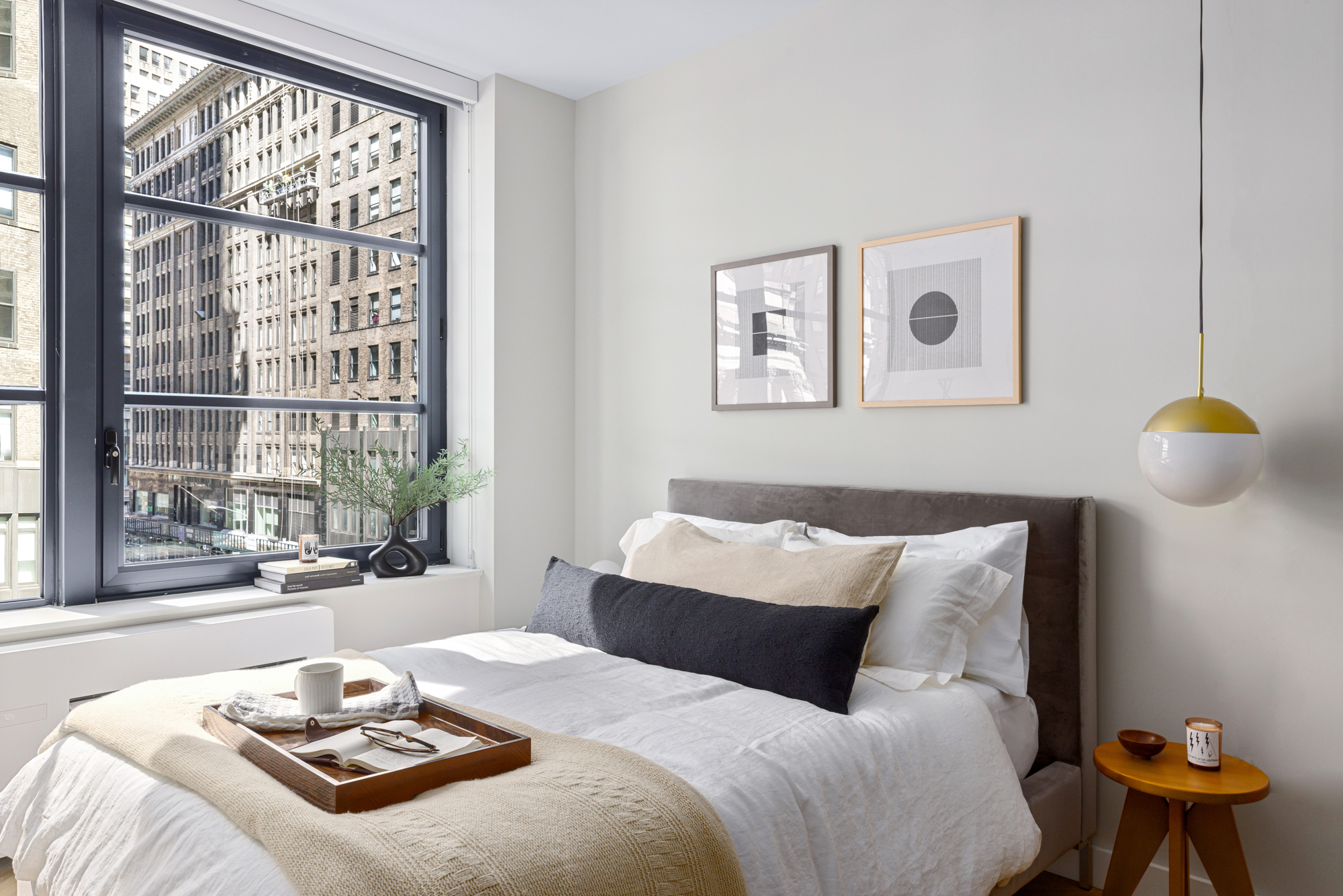 980 6th Avenue, Unit 412 Manhattan, NY 10018 - Photo 5 of 21 a bedroom with a bed and a window