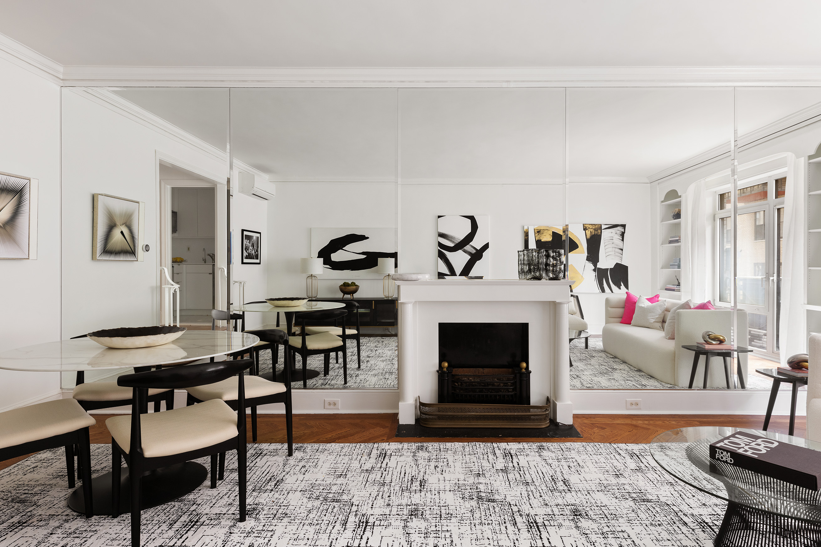 150 Central Park South, Unit 1010 Manhattan, NY 10019 - Photo 2 of 9 a living room with furniture and a fireplace