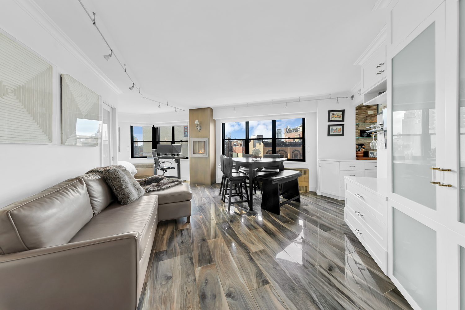 31 Jane Street, Unit 7A Manhattan, NY 10014 - Photo 1 of 11 a living room with furniture and a wooden floor