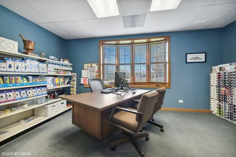 a room with furniture and a bookshelf