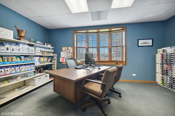 a room with furniture and a bookshelf
