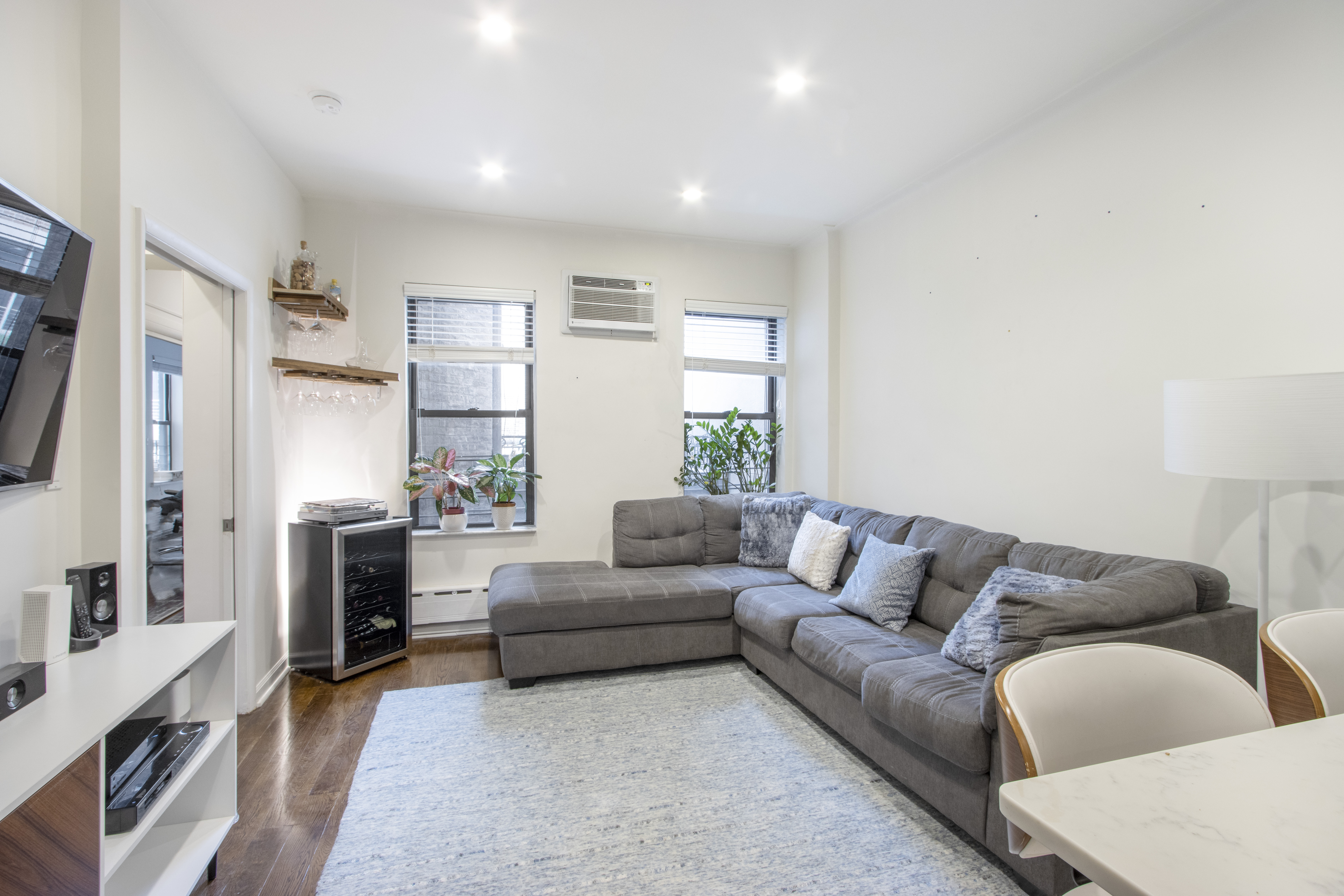 160 East 74th Street, Unit 3 Manhattan, NY 10021 - Photo 3 of 12 a living room with furniture and a fireplace