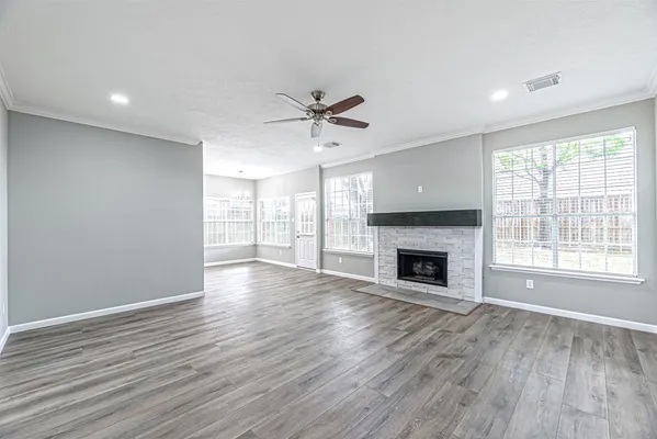 a view of a room window and wooden floor
