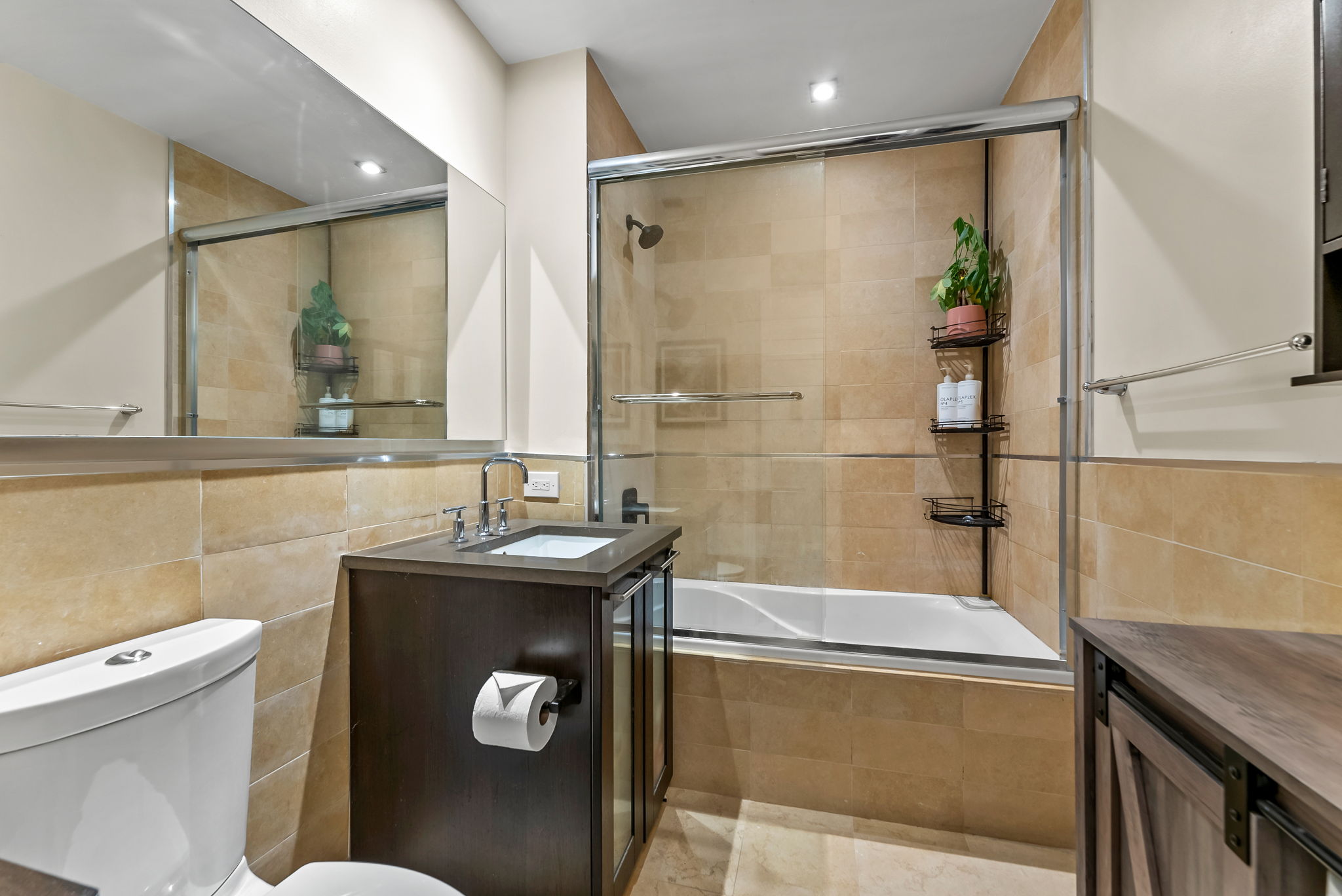 64-05 Yellowstone Boulevard, Unit 414 Queens, NY 11375 - Photo 6 of 14 a bathroom with a granite countertop sink a toilet and shower