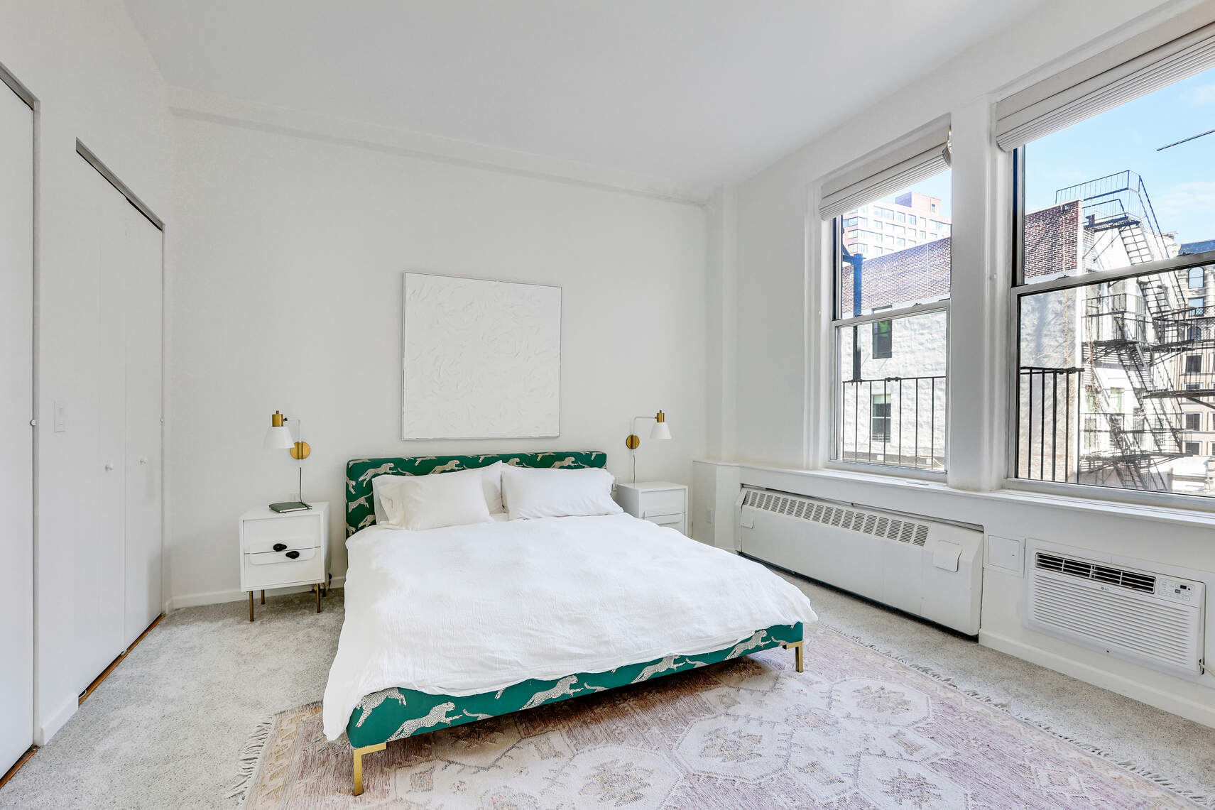 35 East 12th Street, Unit 8C Manhattan, NY 10003 - Photo 8 of 22 a spacious bedroom with a bed and a window