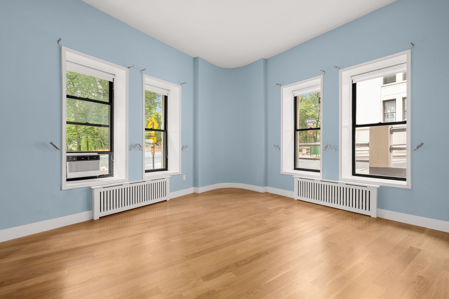 265 Riverside Drive, Unit 1C Manhattan, NY 10025 - Photo 5 of 10 an empty room with windows