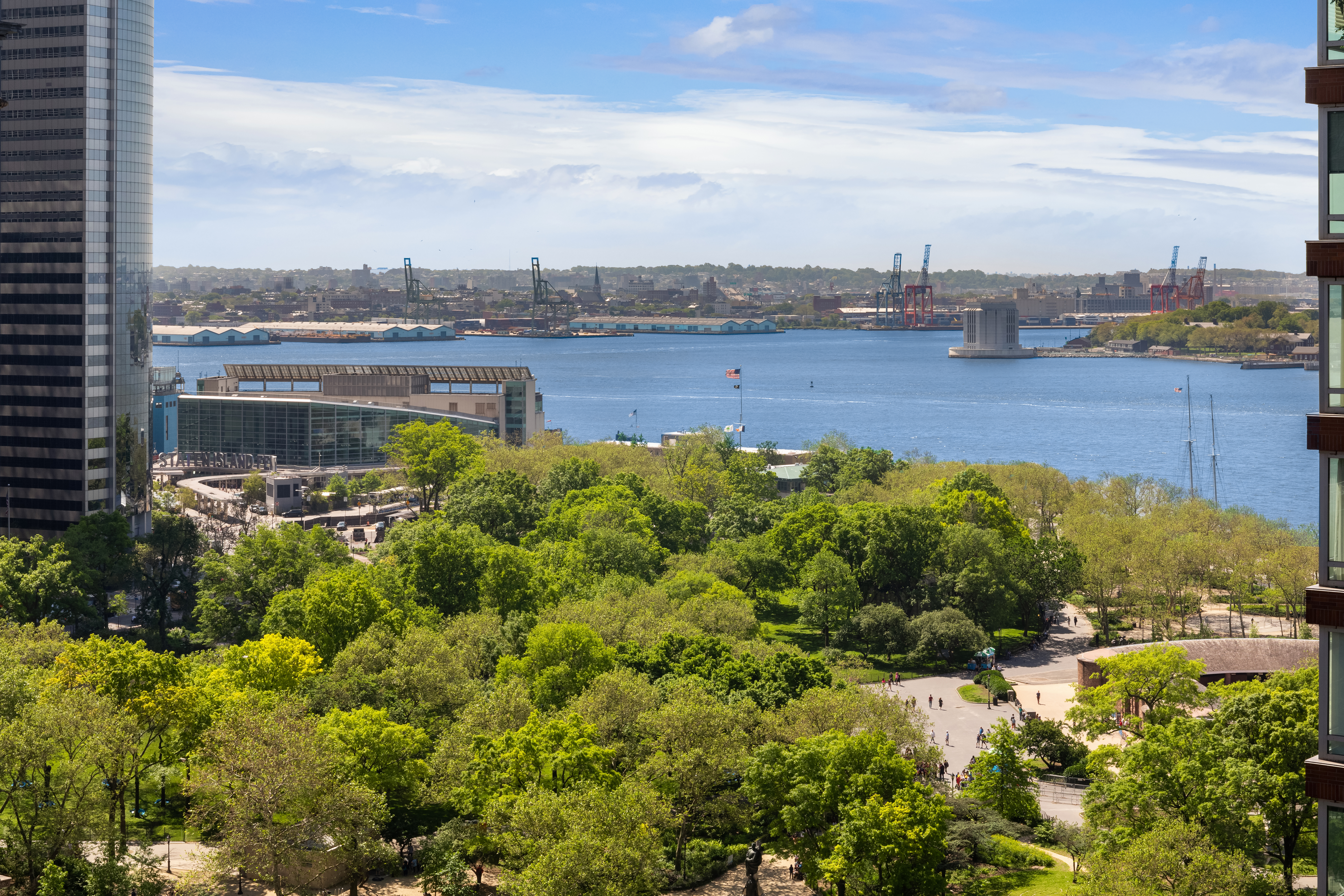 30 West Street, Unit 23F Manhattan, NY 10004 - Photo 10 of 12 a view of a lake with houses