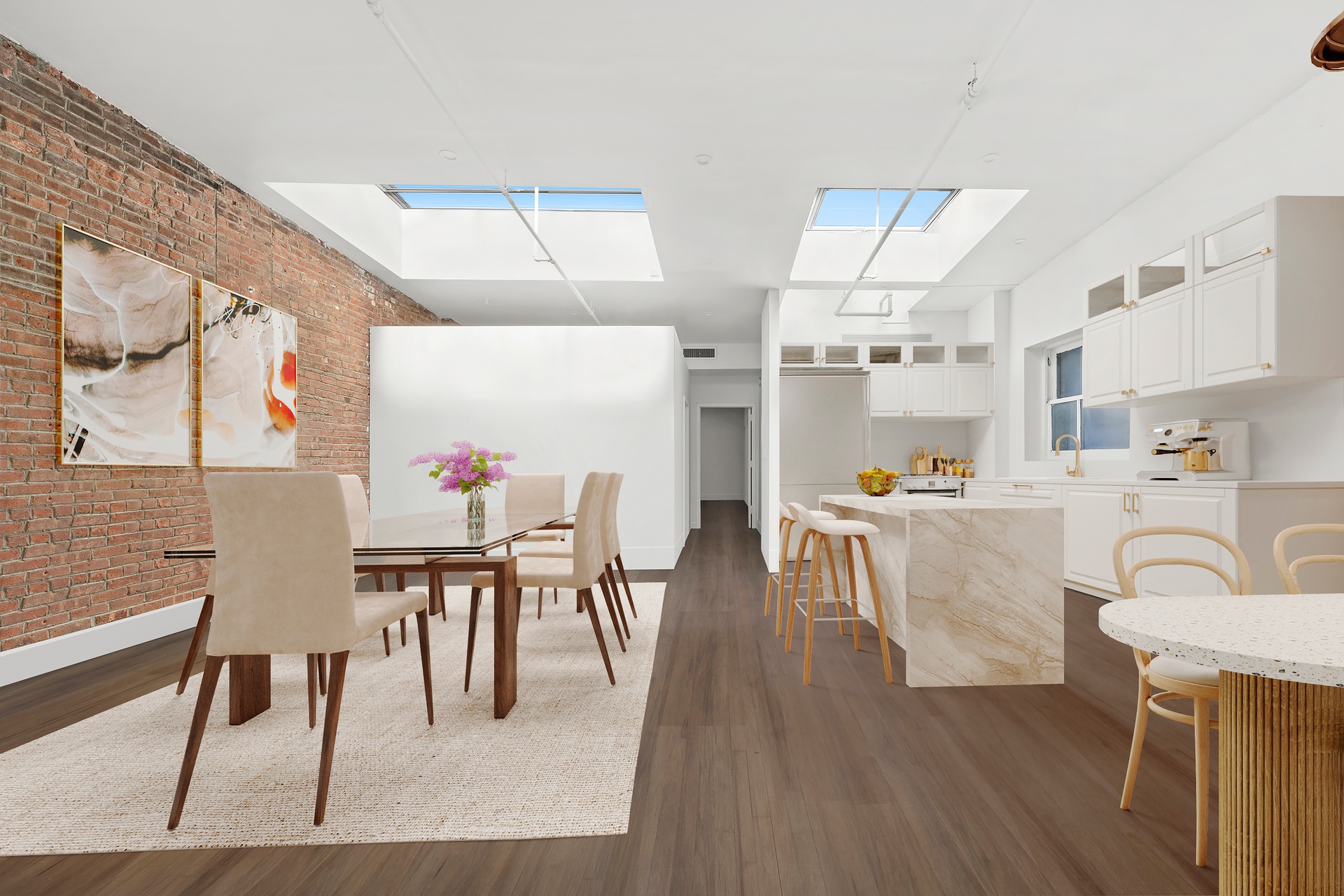 99 Spring Street, Unit PH Manhattan, NY 10012 - Photo 12 of 23 a view of a dining room with furniture and wooden floor