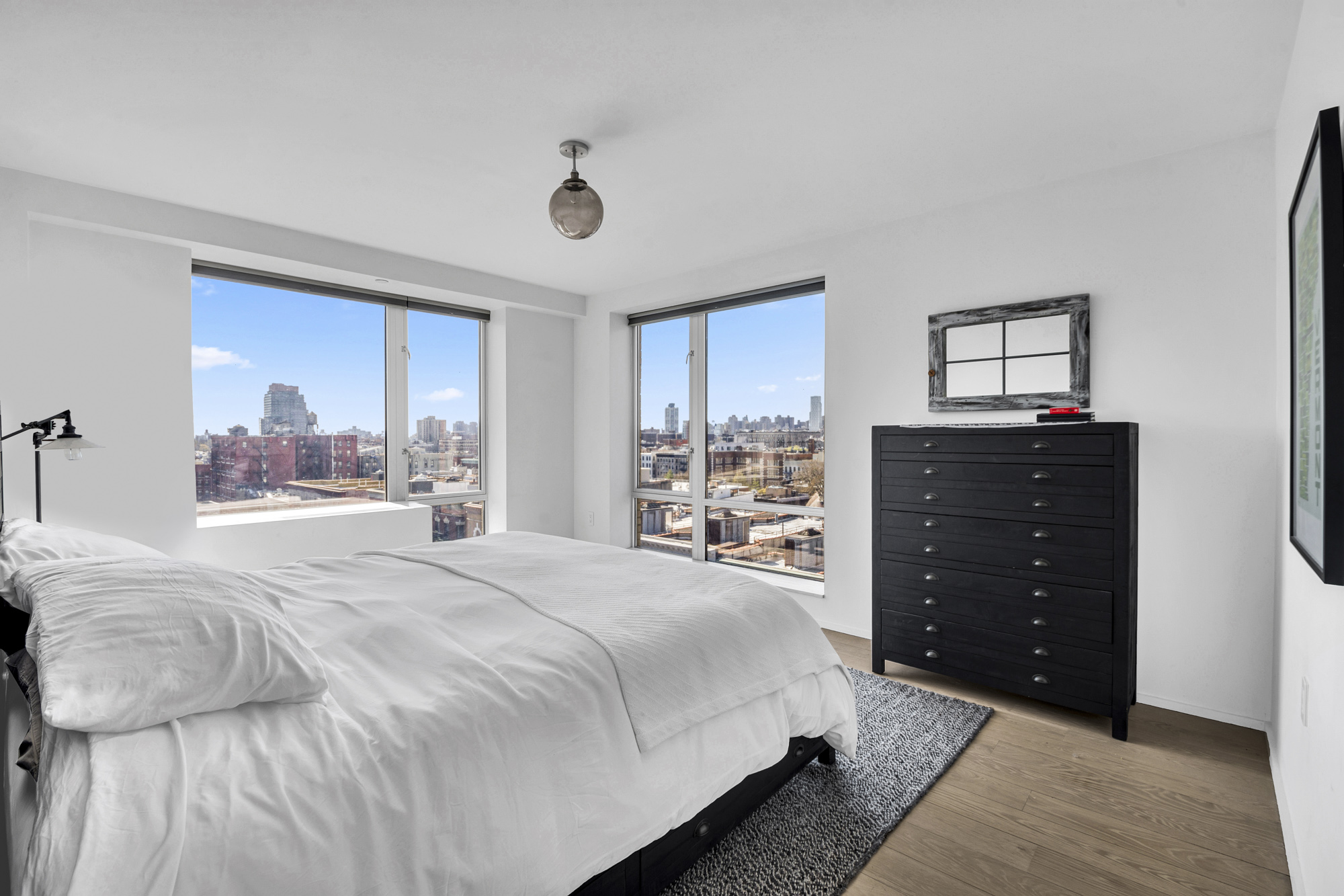 2280 Frederick Douglass Boulevard, Unit 10B Manhattan, NY 10027 - Photo 10 of 15 a bedroom with a bed and a dresser