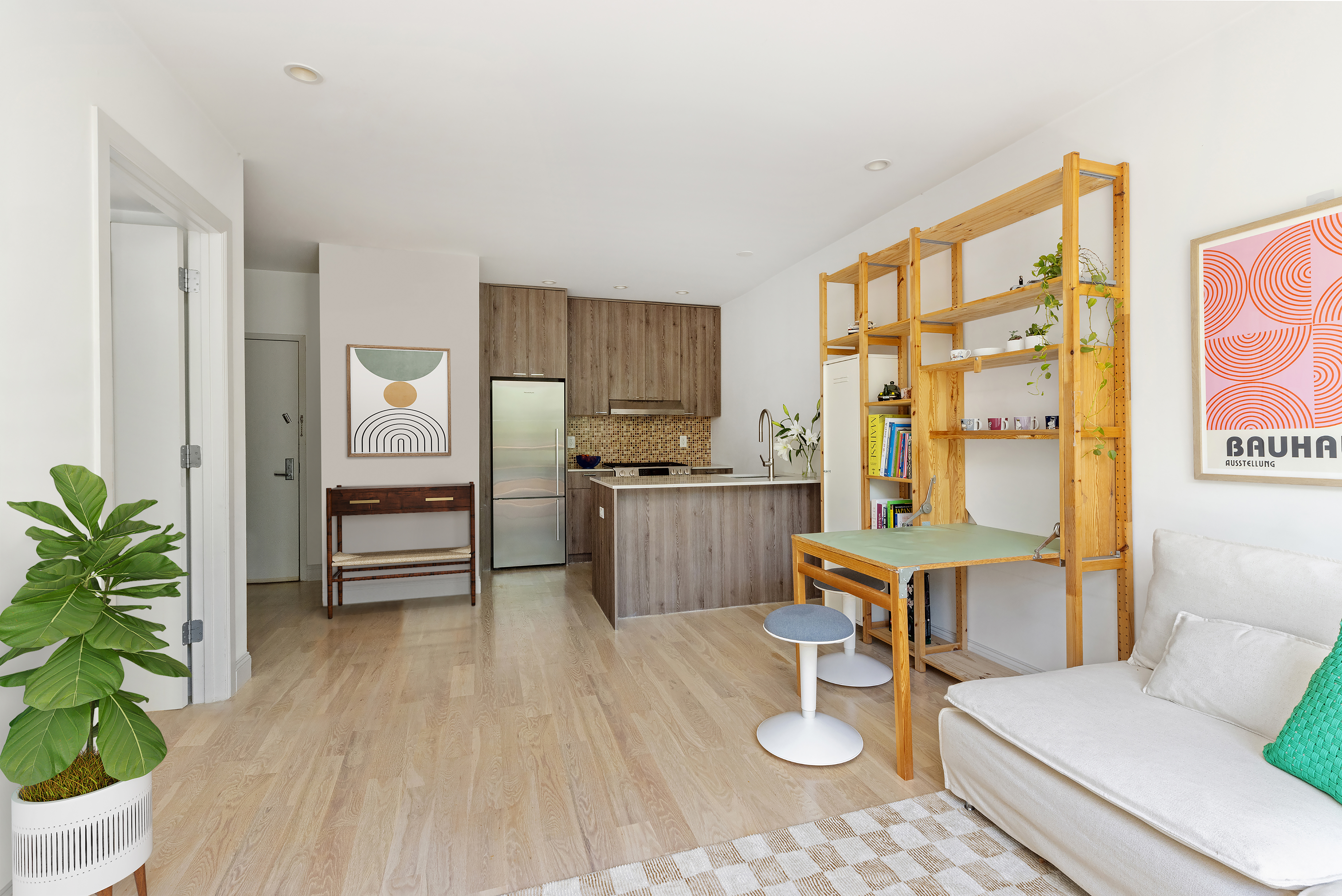 1094 Madison Street, Unit 2A Brooklyn, NY 11221 - Photo 3 of 7 a living room with furniture and wooden floor