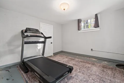 a view of room with window and hallway