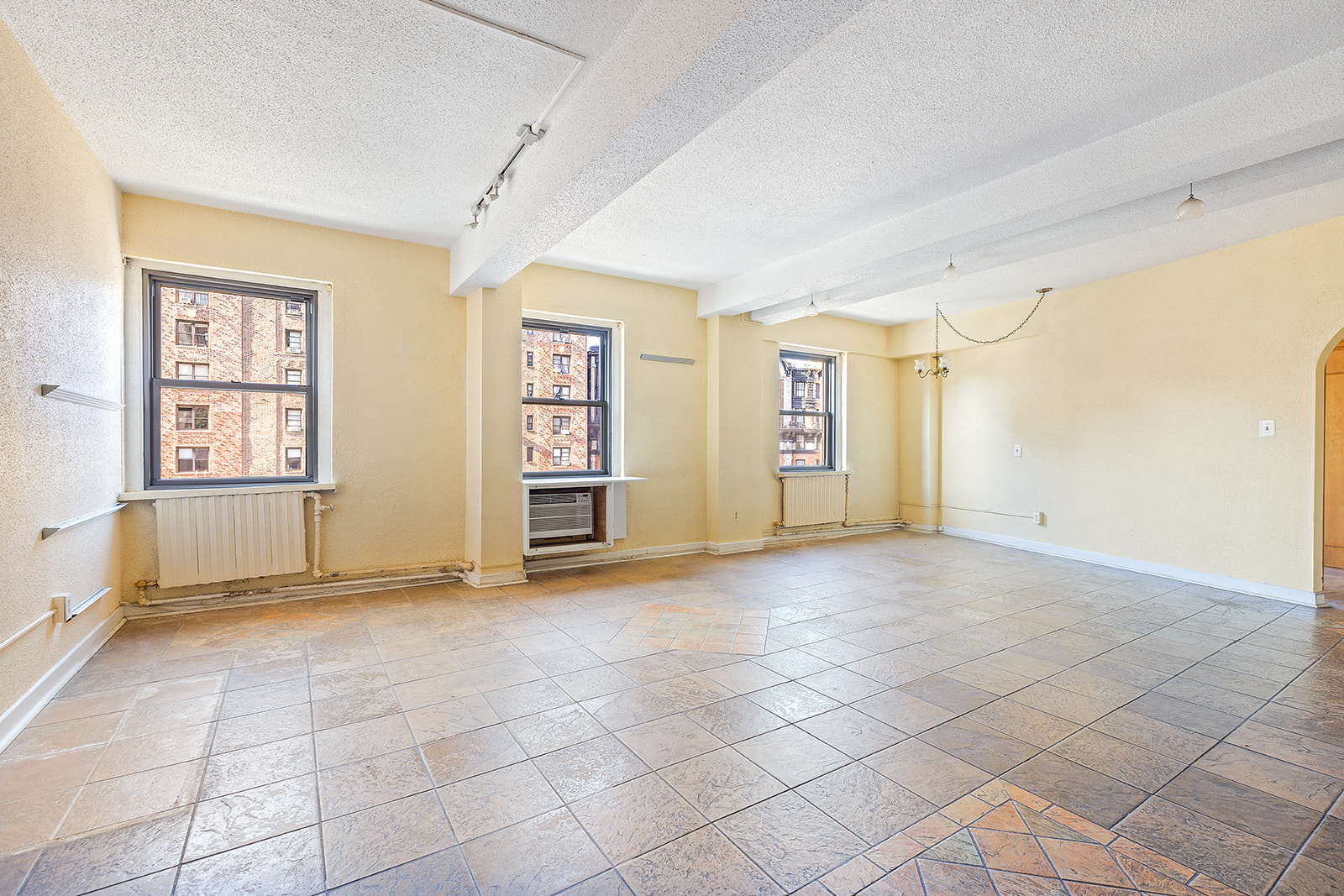 2166 Broadway, Unit 7A Manhattan, NY 10024 - Photo 3 of 8 a view of an empty room with a window