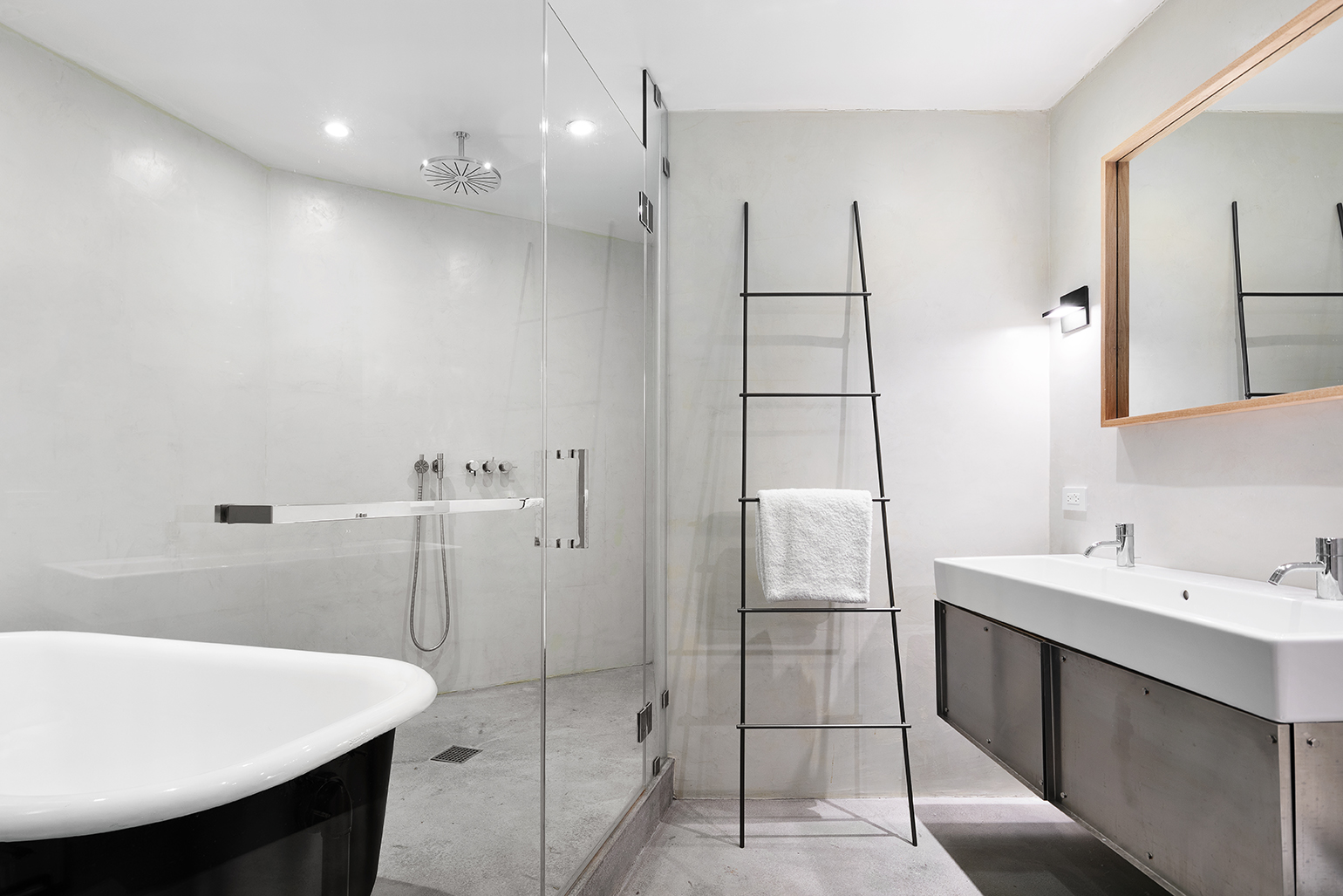 59 4th Avenue, Unit 2B Manhattan, NY 10003 - Photo 7 of 14 a bathroom with a sink a toilet and shower