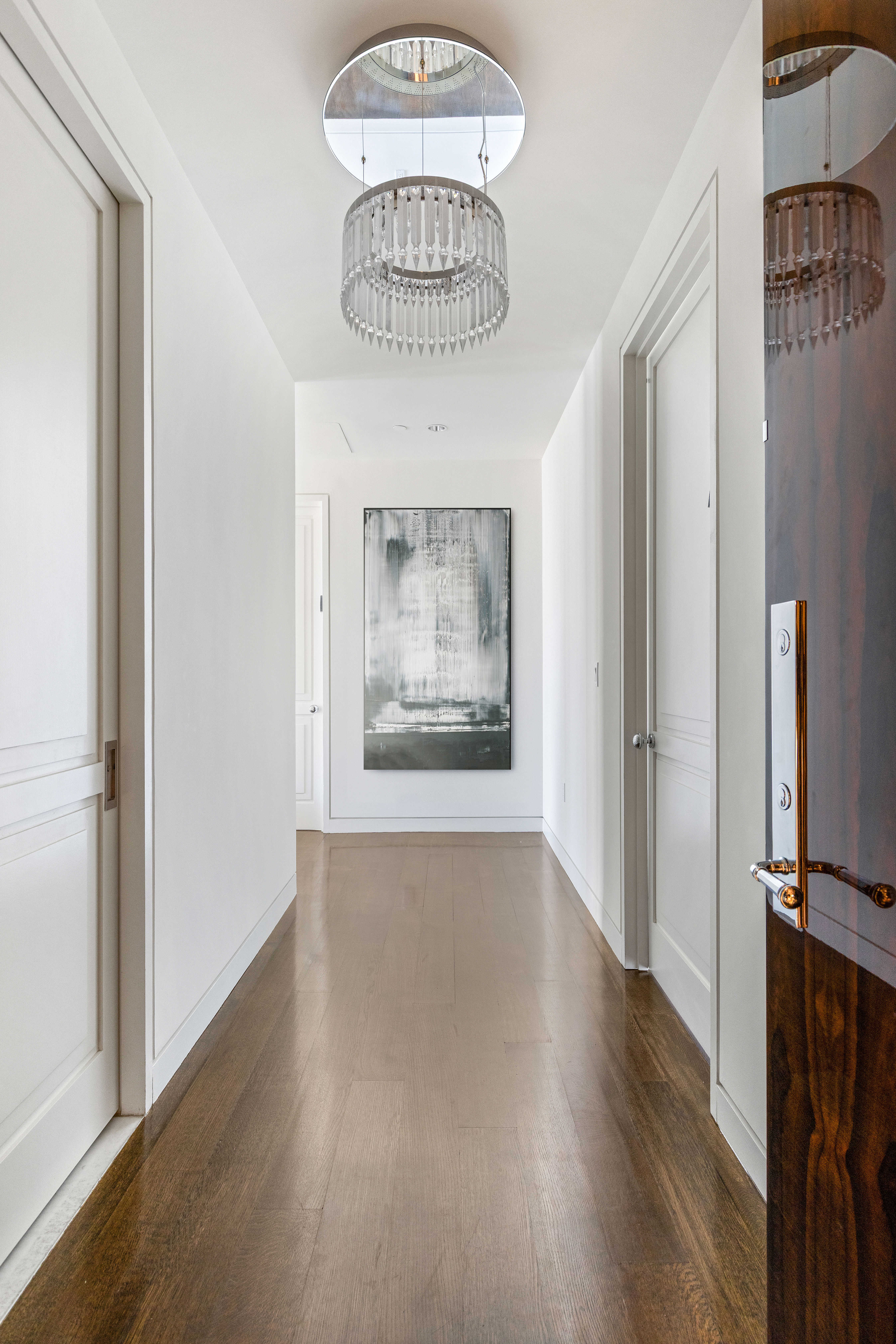 20 West 53rd Street, Unit 22A Manhattan, NY 10019 - Photo 11 of 16 a view of a hallway with wooden floor