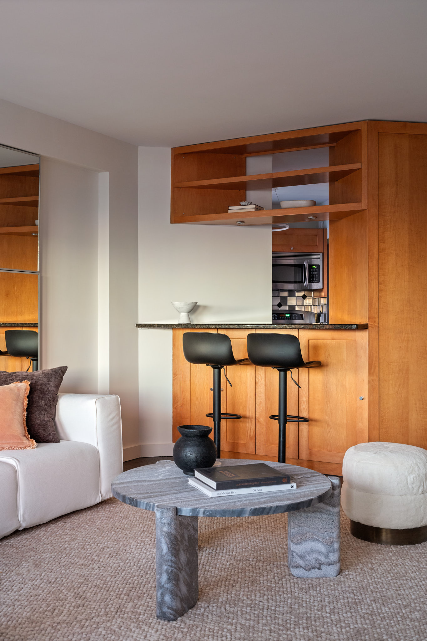 31 Jane Street, Unit 16G Manhattan, NY 10014 - Photo 8 of 20 a bedroom with furniture and a lamp