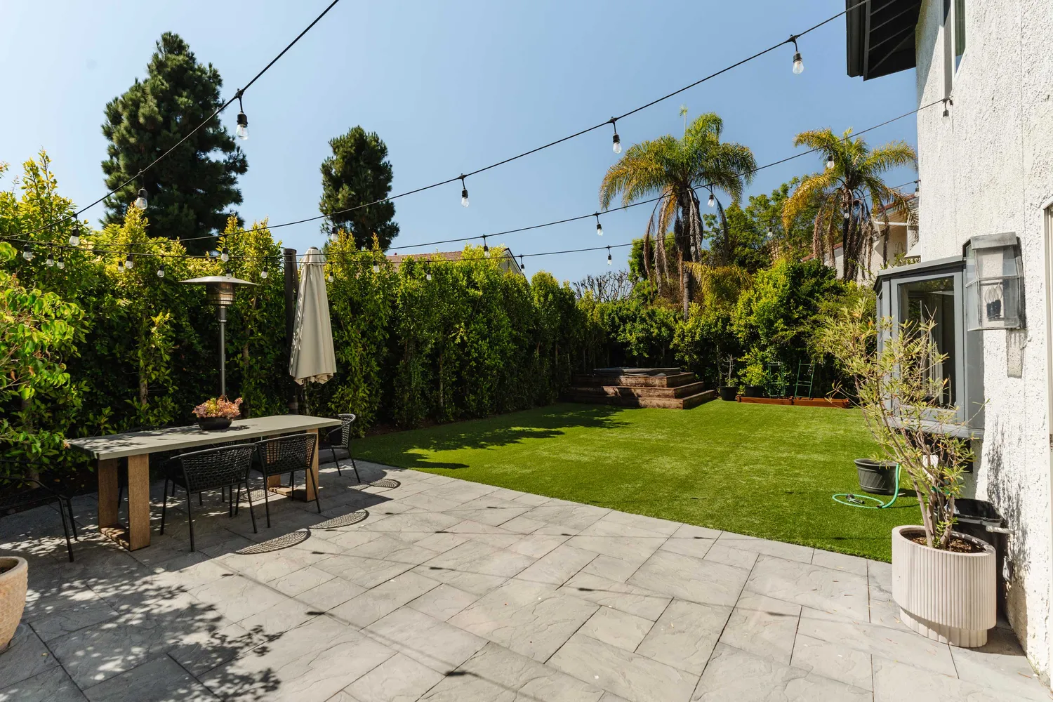 a view of a backyard with sitting area