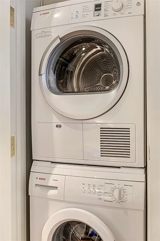 93 Worth Street, Unit 405 Manhattan, NY 10013 - Photo 5 of 18 a utility room with dryer and washer