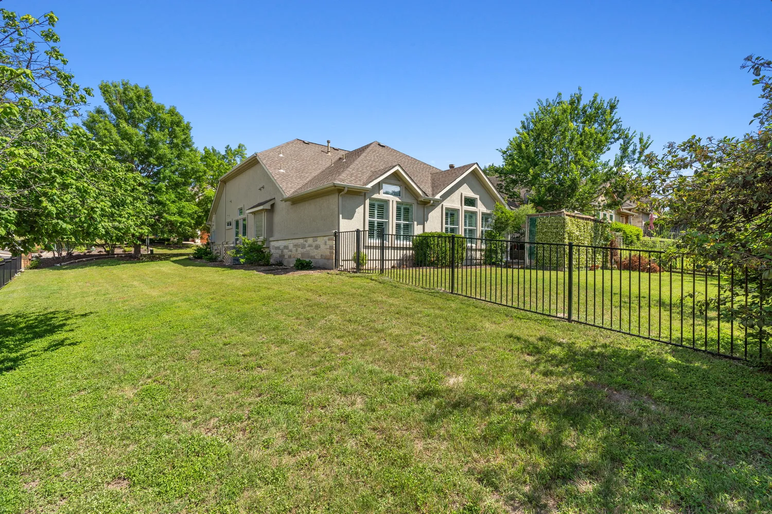 a view of a house with a yard and porch