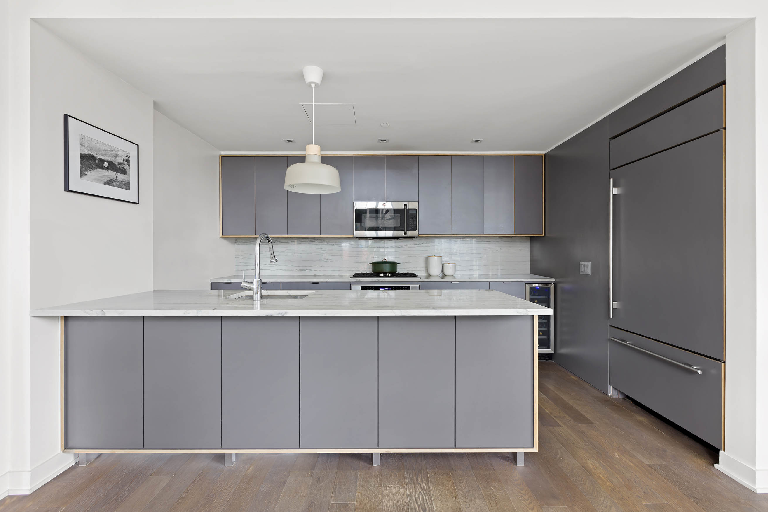 205 Water Street, Unit PHC Brooklyn, NY 11201 - Photo 6 of 14 a kitchen with stainless steel appliances granite countertop a sink stove and refrigerator