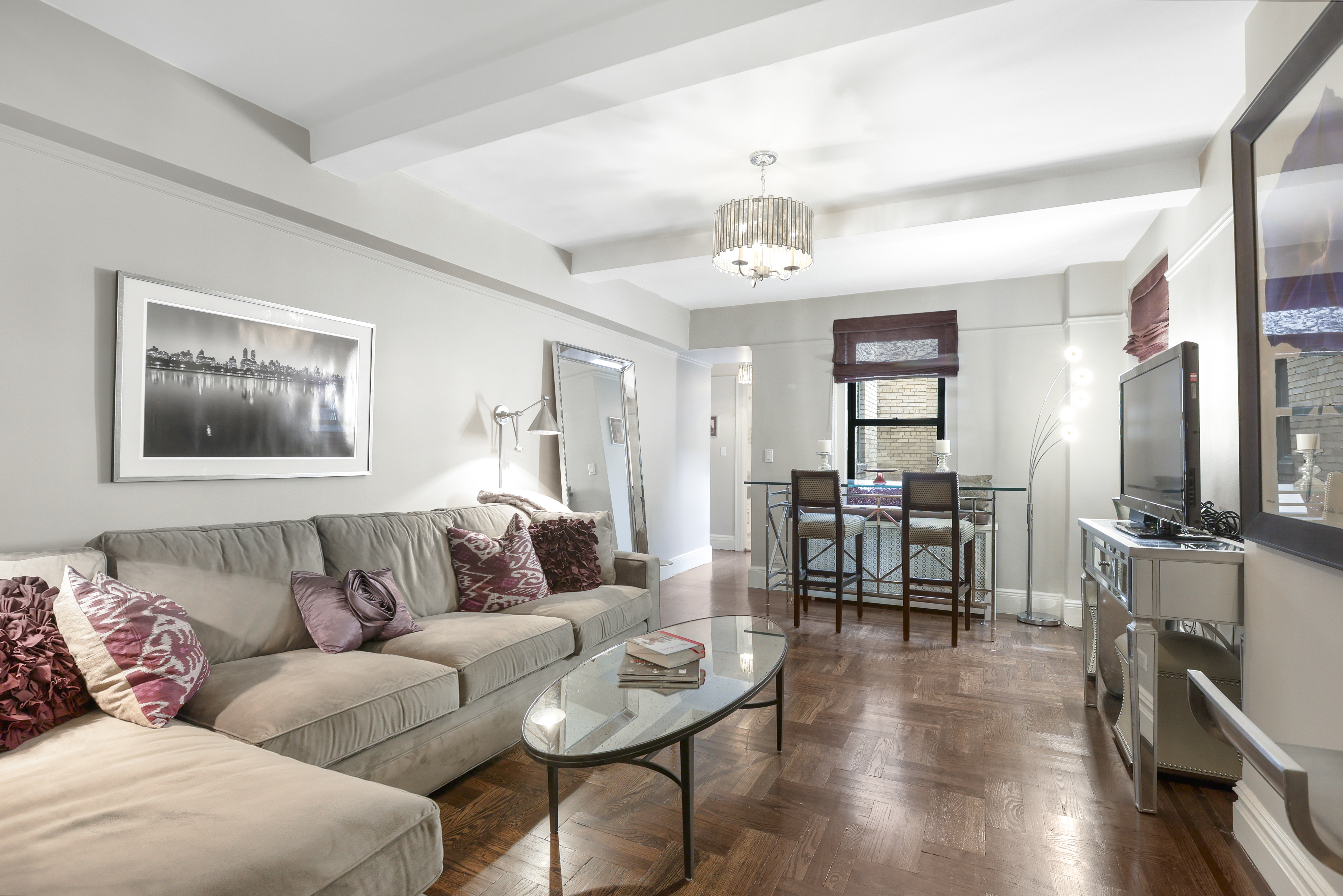 65 West 95th Street, Unit 7G Manhattan, NY 10025 - Photo 4 of 9 a living room with furniture and wooden floor