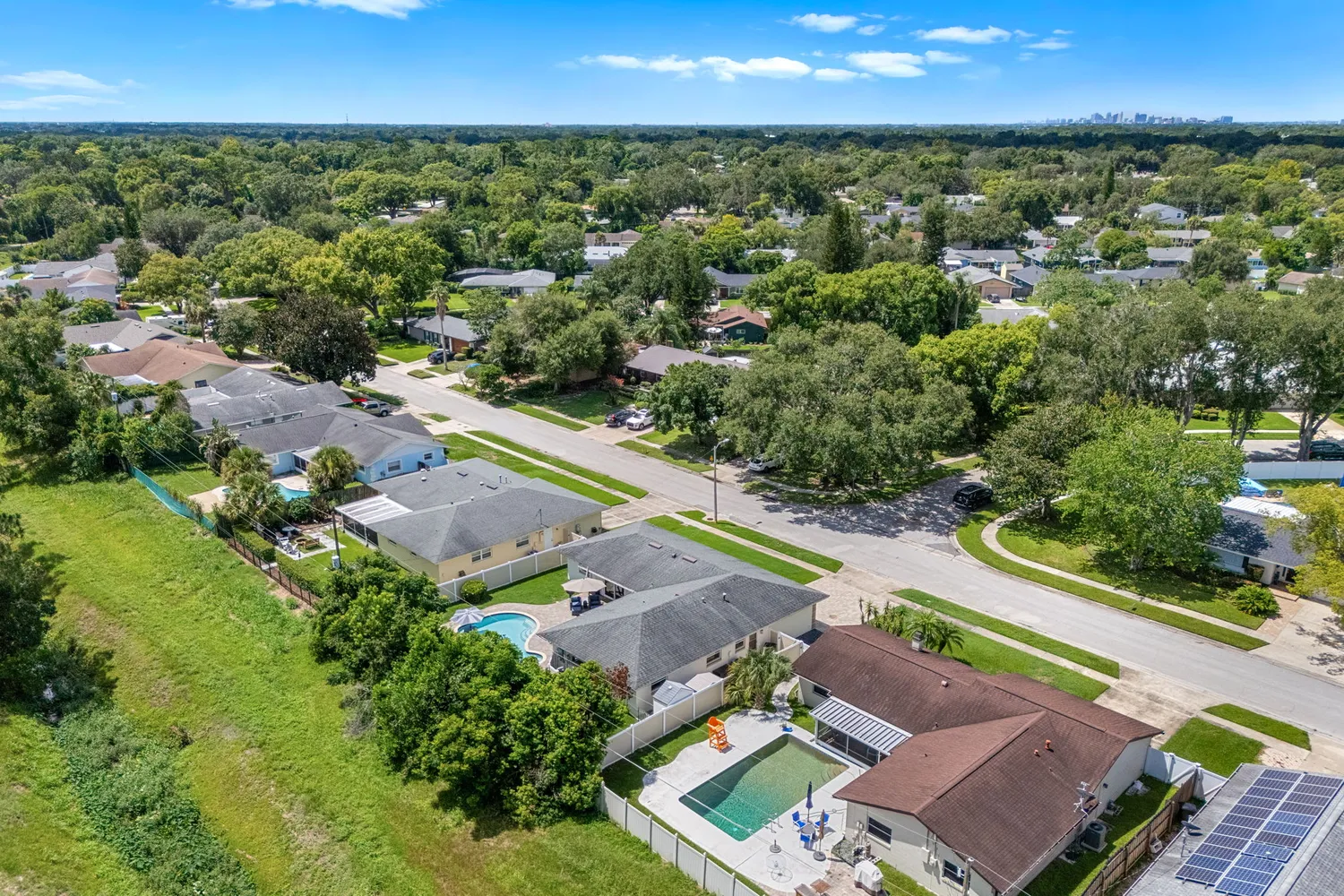 an aerial view of a house with outdoor space