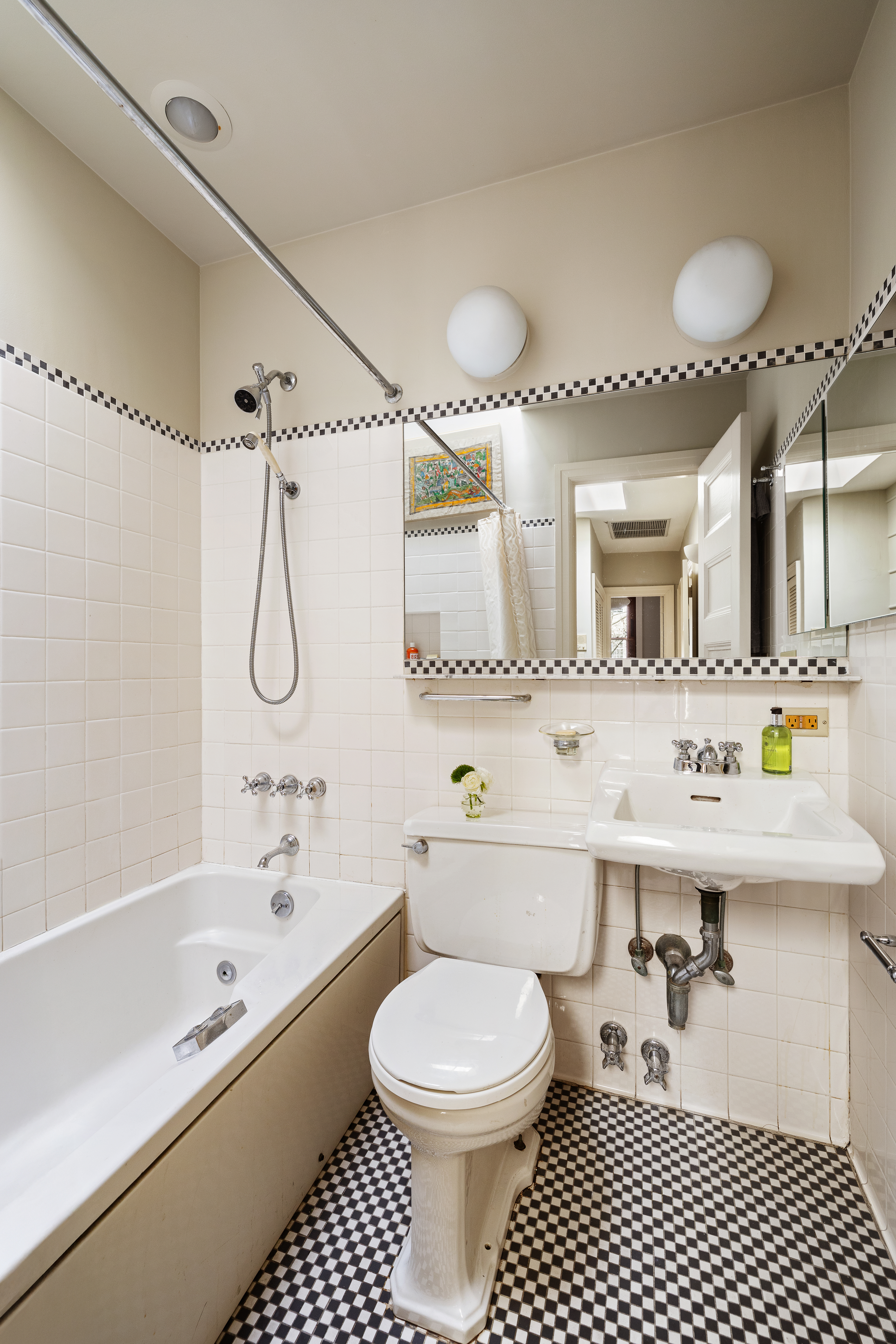26 Pierrepont Street, Unit 2 Brooklyn, NY 11201 - Photo 17 of 21 a bathroom with a sink a toilet and a mirror