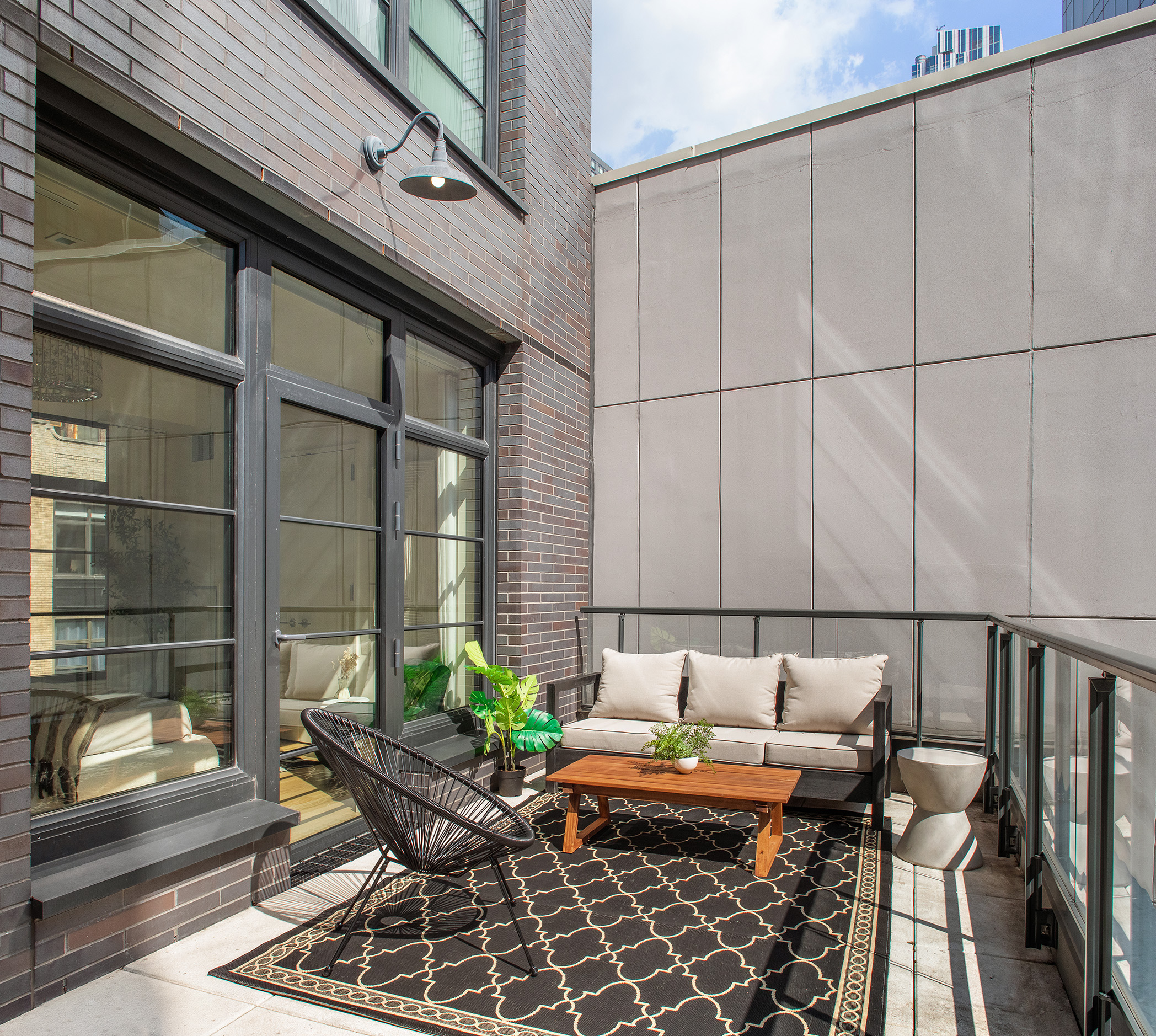 50 West 30th Street, Unit 3E Manhattan, NY 10001 - Photo 8 of 9 a backyard of a house with outdoor seating