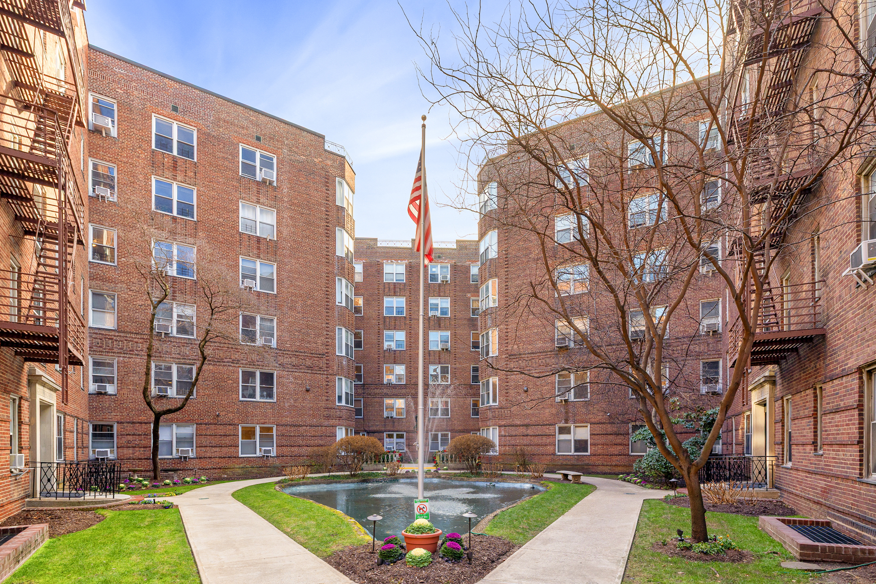 73-12 35th Avenue, Unit D56 Queens, NY 11372 - Photo 9 of 15 a view of a building with a yard
