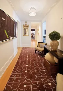 a living room with a couch and a rug