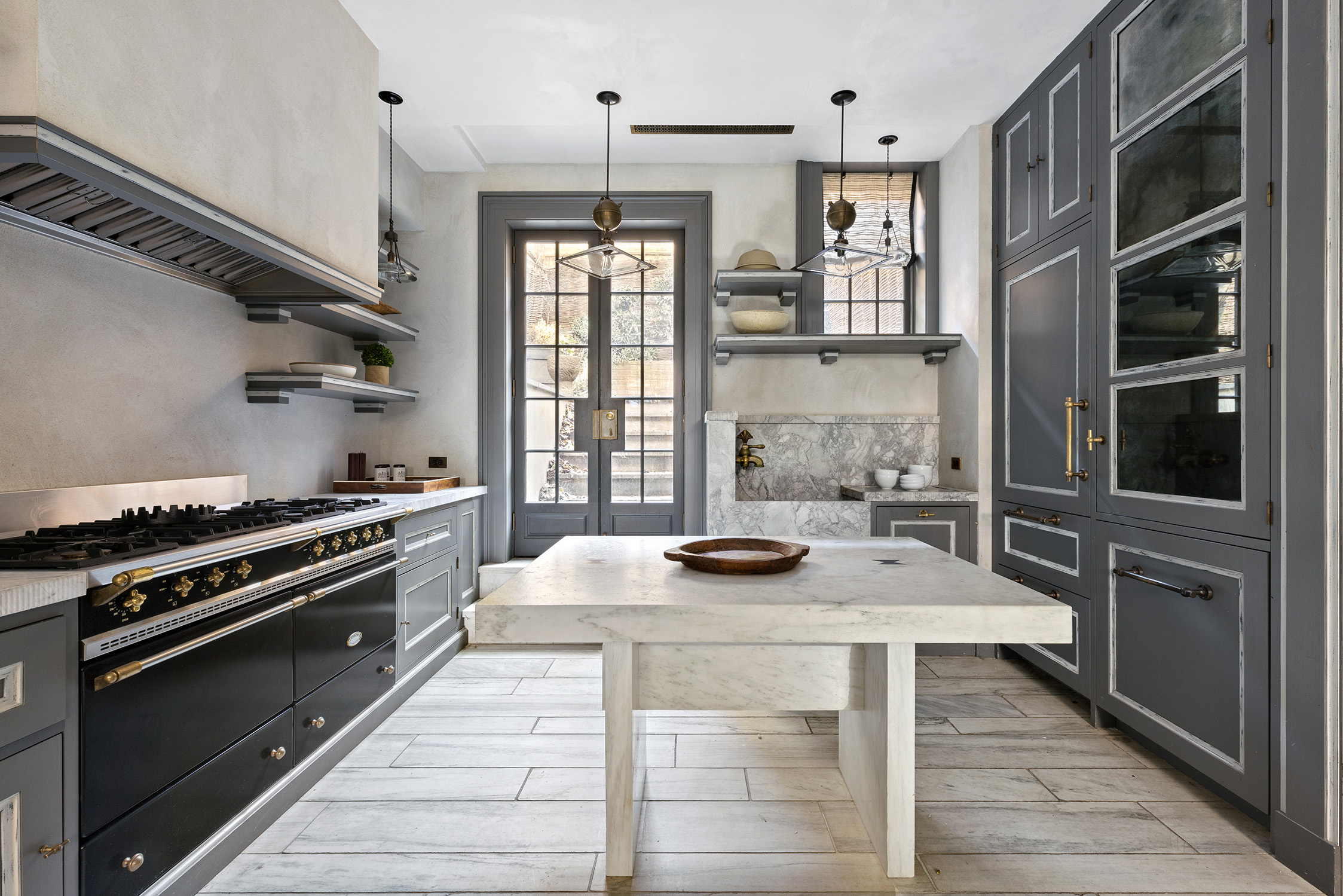 68 Morton Street Manhattan, NY 10014 - Photo 7 of 21 a kitchen with a stove and a wooden floor