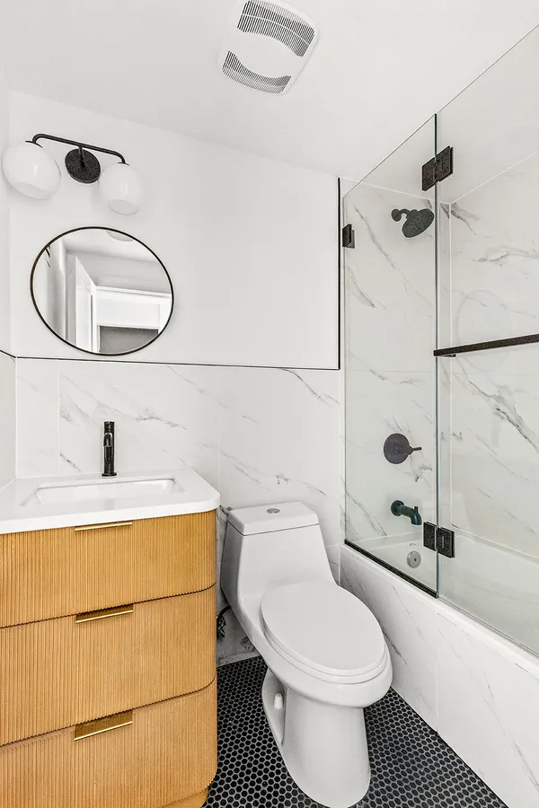 a toilet sitting next to a bathroom sink