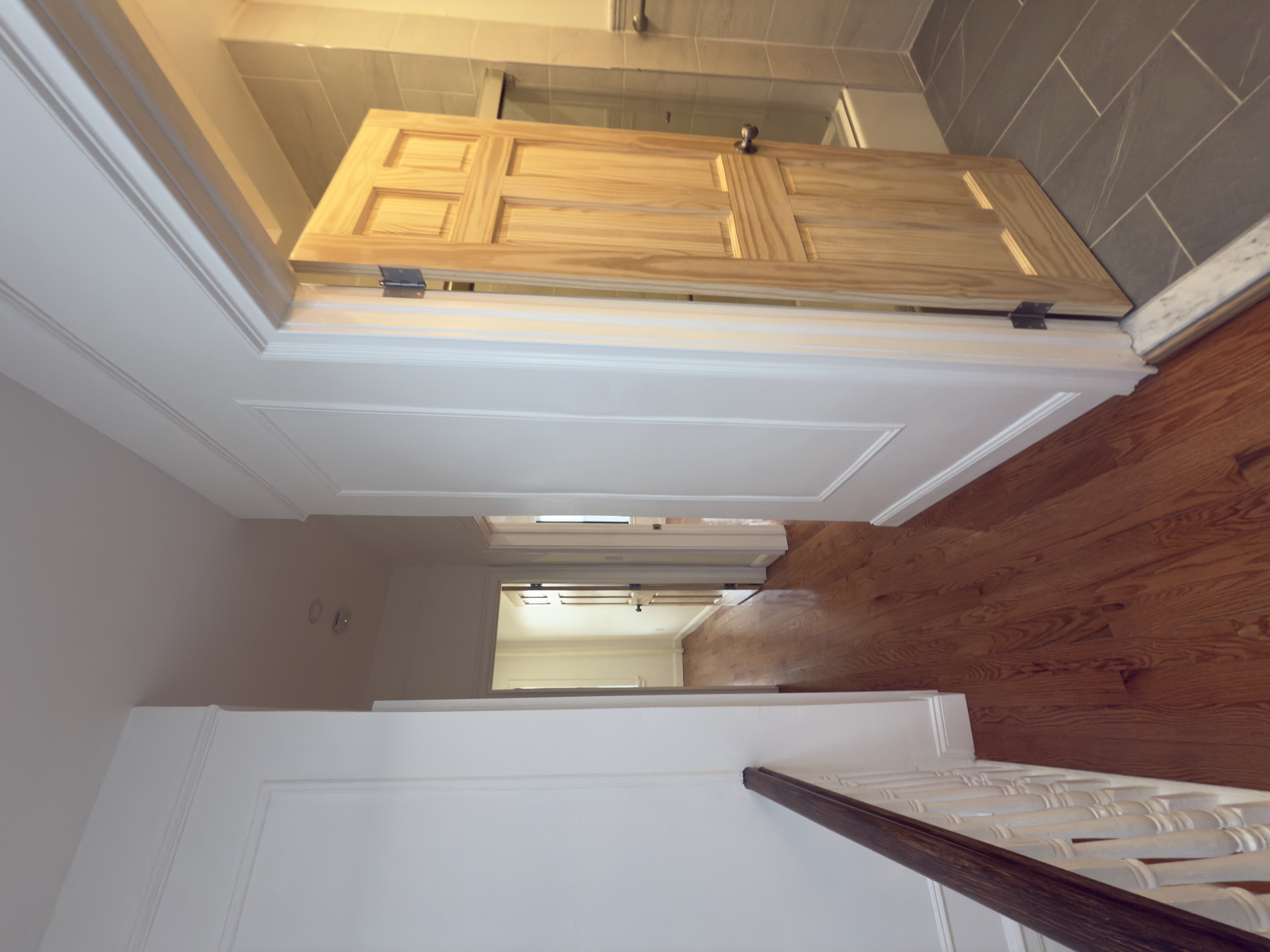 82 74th Street Brooklyn, NY 11209 - Photo 9 of 21 a view of a hallway with wooden floor and closet