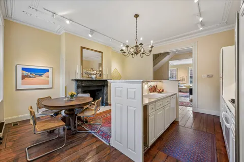 a kitchen that has a table and chairs in it