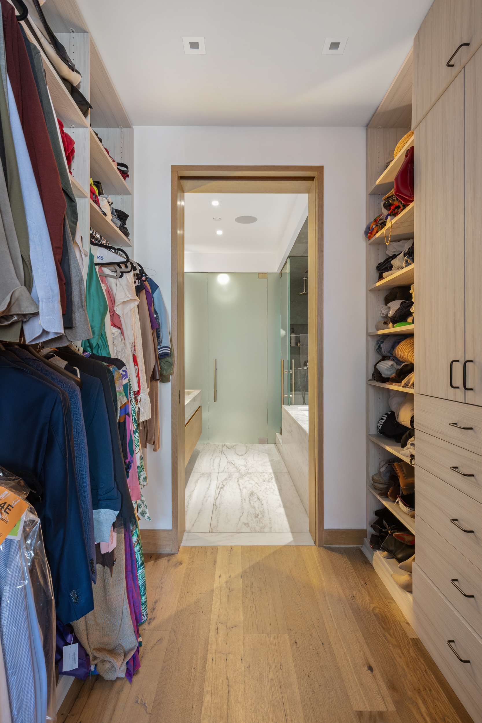 60 White Street, Unit 4E Manhattan, NY 10013 - Photo 14 of 19 a view of walk in closet with clothes and shoes