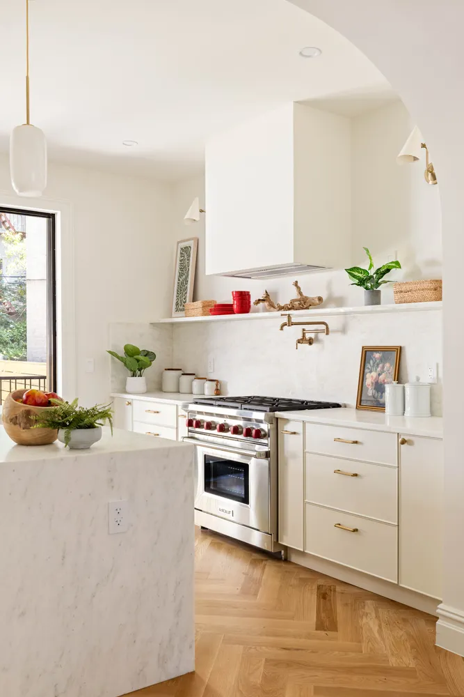 a kitchen with granite countertop a stove and a sink