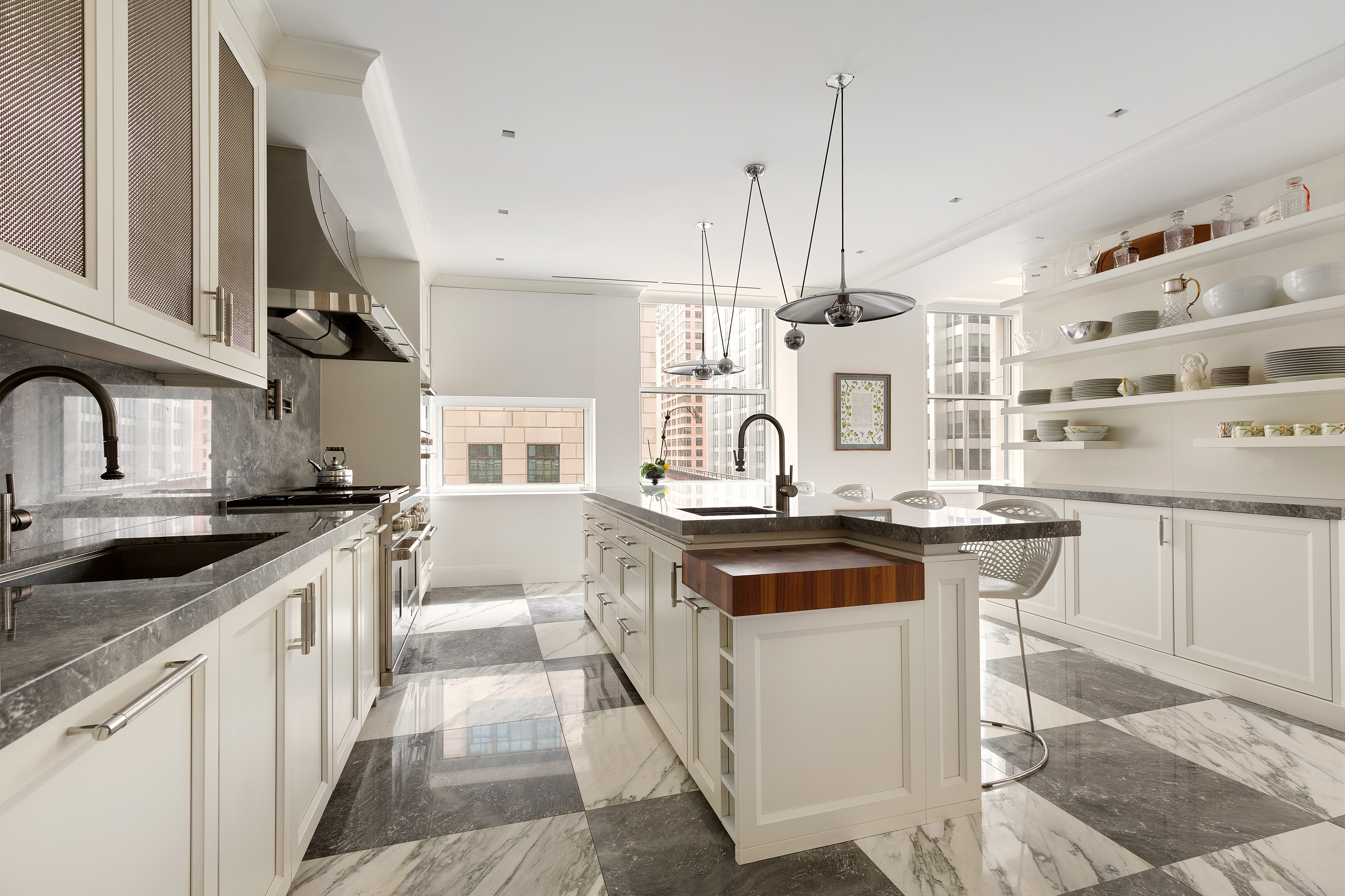 55 Liberty Street, Unit 15 Manhattan, NY 10005 - Photo 10 of 25 a kitchen with stainless steel appliances granite countertop a stove and a sink