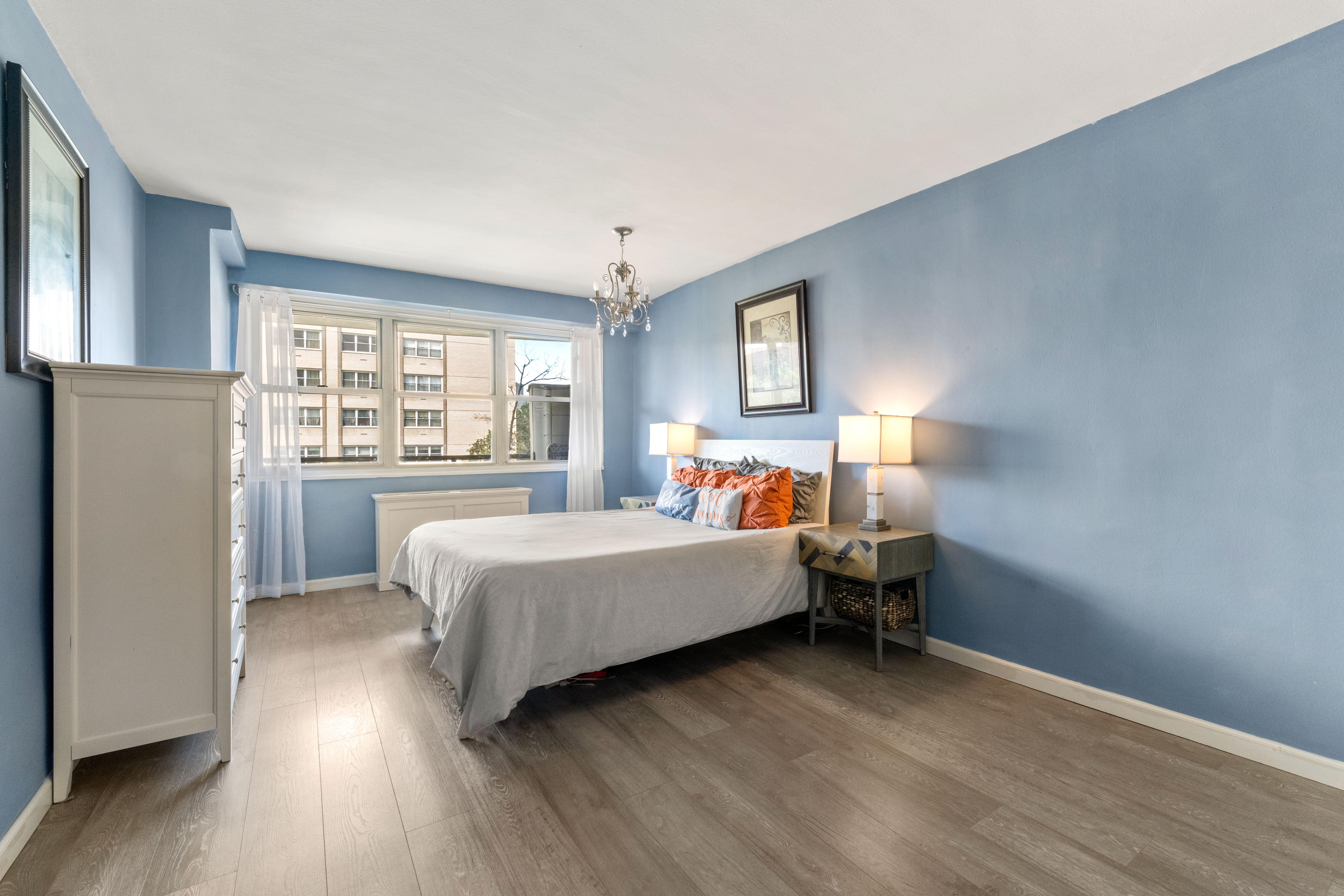 102-30 66th Road, Unit 7E Queens, NY 11375 - Photo 11 of 15 a bed room with a bed and a window