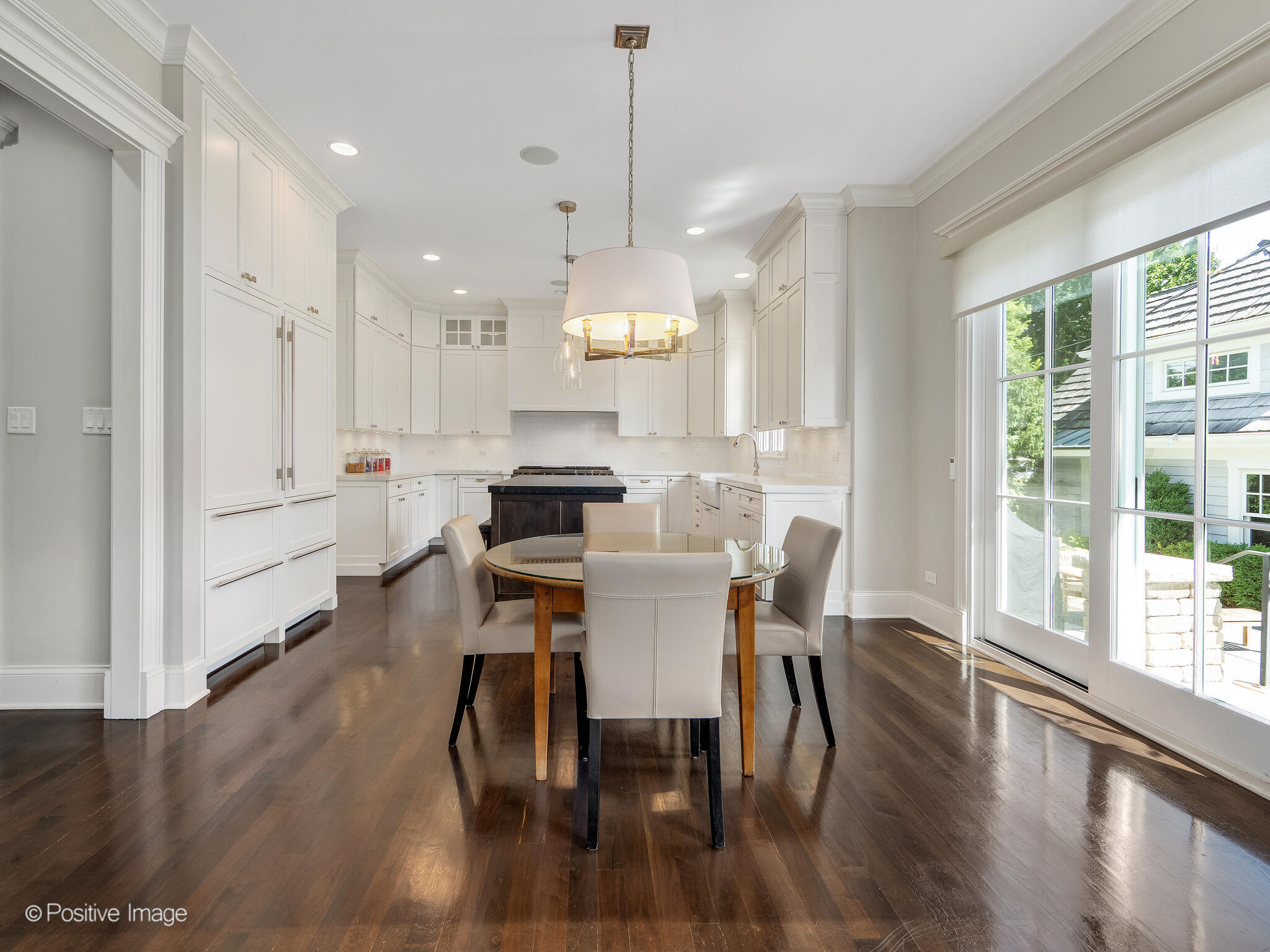 17 South Bruner Street Hinsdale, IL 60521 - Photo 14 of 42 a view of a dining room and livingroom with furniture wooden floor kitchen chandelier