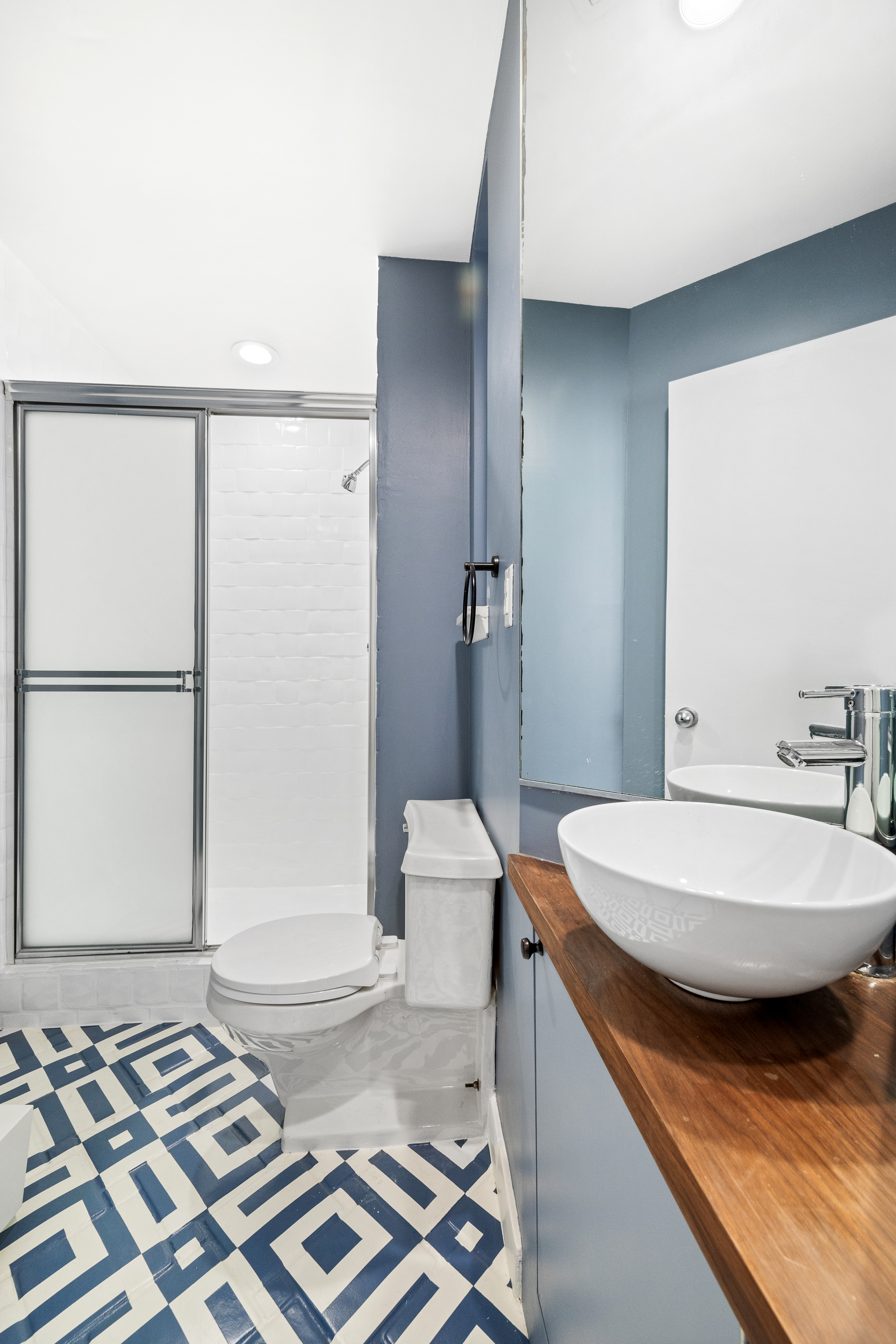 330 West End Avenue, Unit PHB Manhattan, NY 10023 - Photo 15 of 20 a spacious bathroom with a granite countertop sink and a mirror