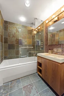 a bathroom with a bathtub and a sink