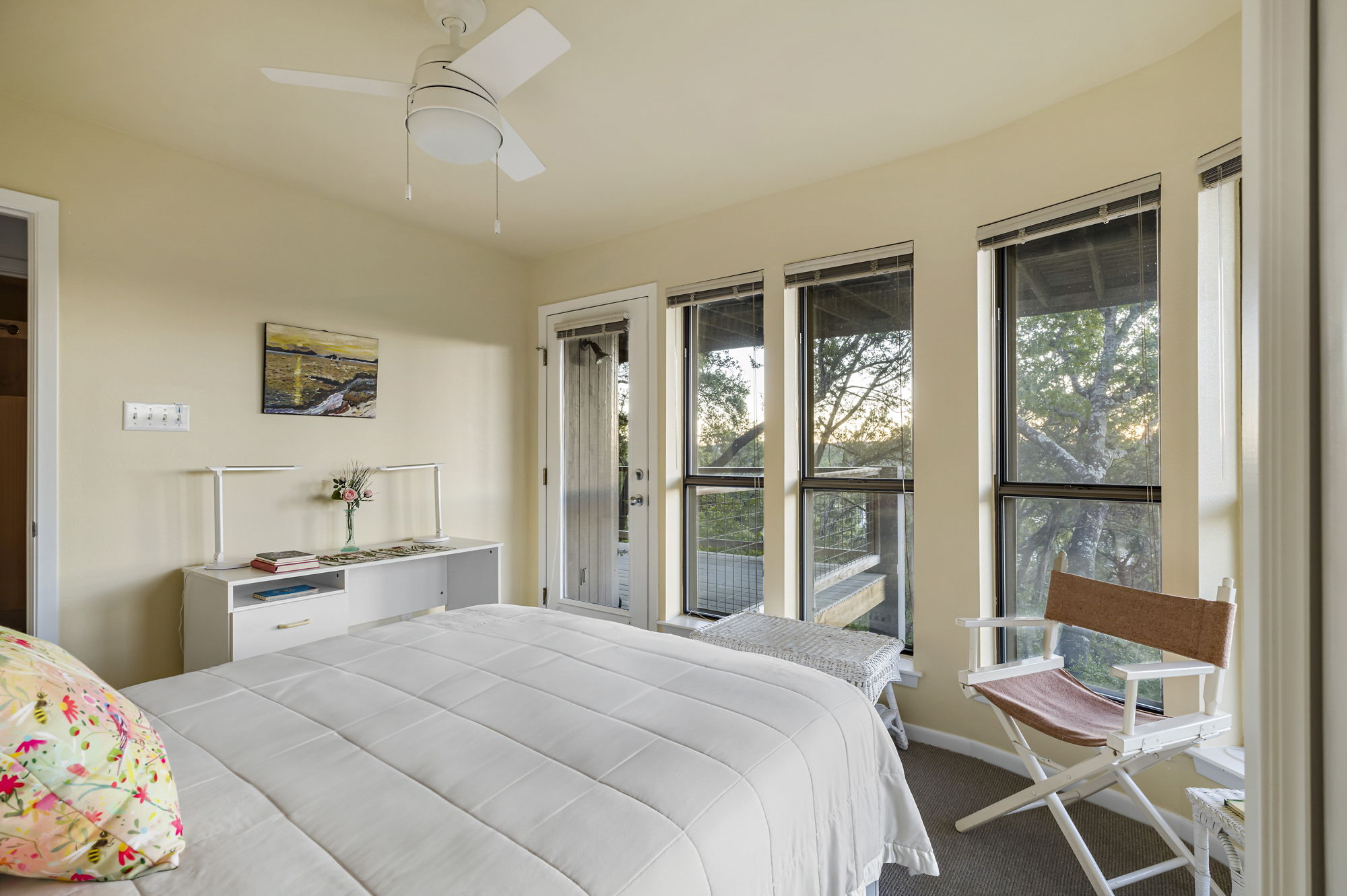 1605 The High Road Austin, TX 78746 - Photo 34 of 45 a bedroom with a bed a large window with the outer view