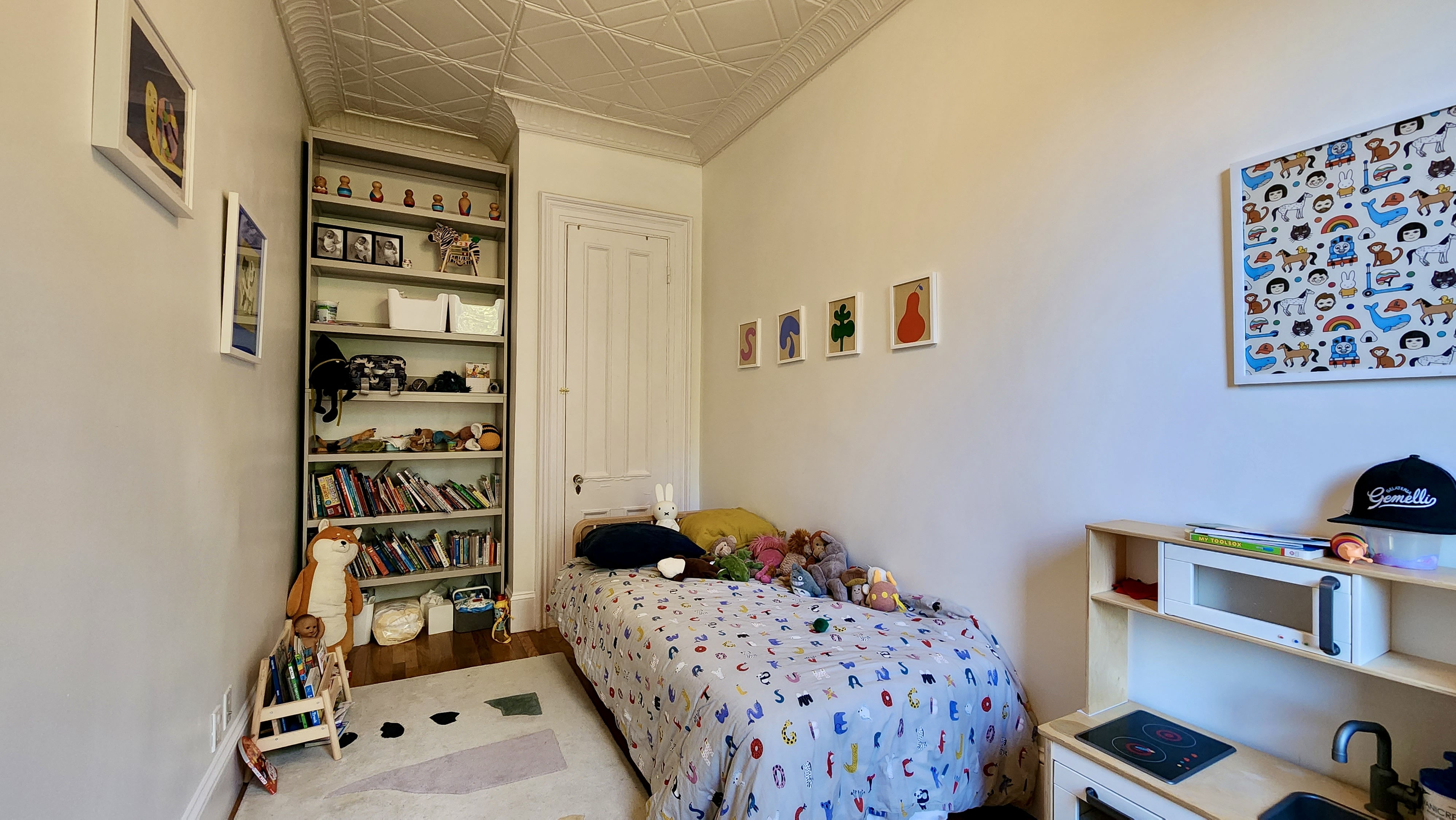 118 1st Place, Unit 2 Brooklyn, NY 11231 - Photo 11 of 12 a bedroom with a bed and a book shelf