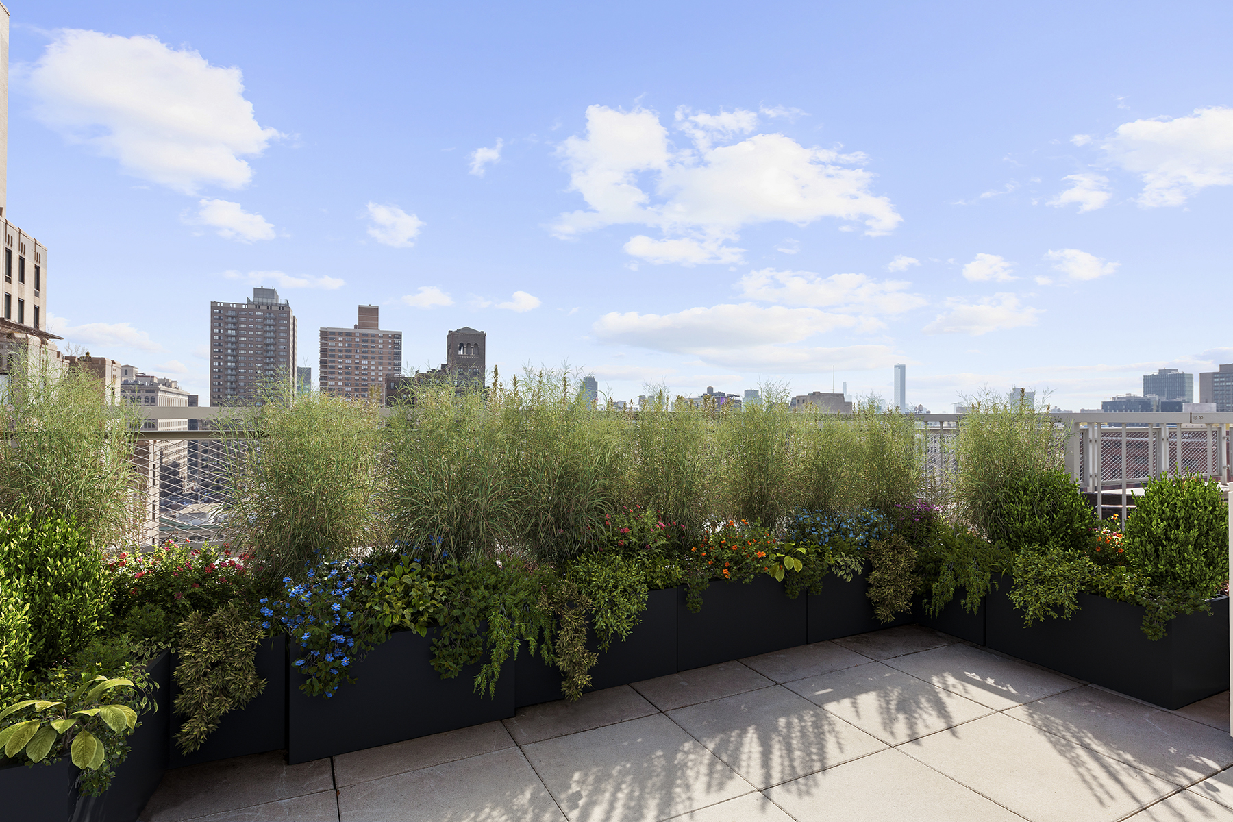 2 5th Avenue, Unit PHC Manhattan, NY 10011 - Photo 6 of 13 a view of a city with lush green forest