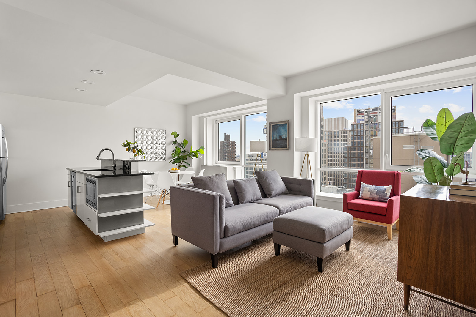 440 Kent Avenue, Unit F18 Brooklyn, NY 11249 - Photo 3 of 16 a living room with furniture and a large window