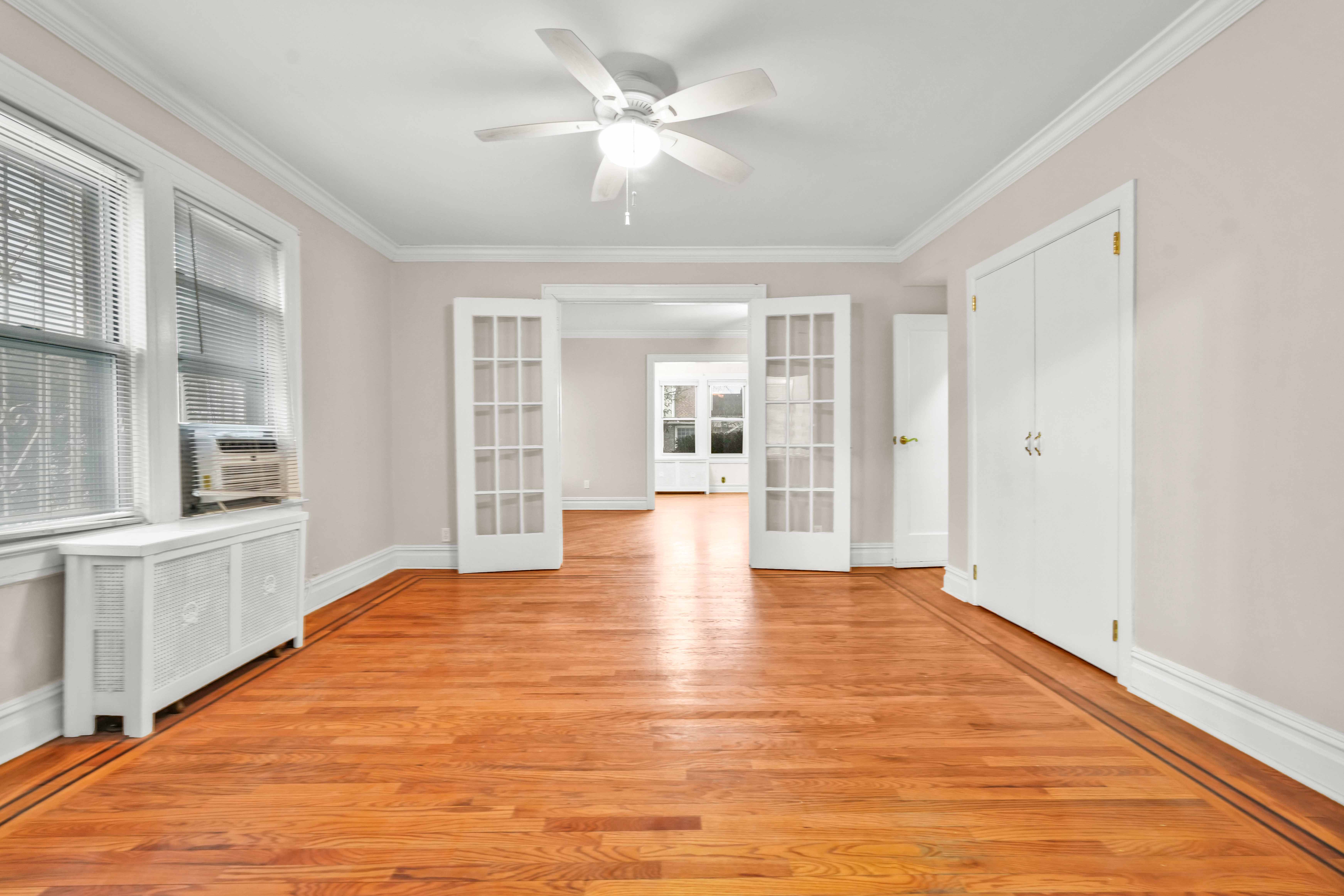 188-22 Lewiston Avenue, Unit 1 Queens, NY 11412 - Photo 7 of 17 a view of an empty room with window and cabinet