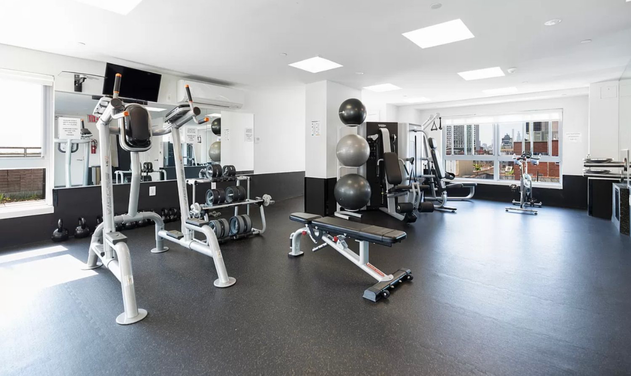171 West 131st Street, Unit 303 Manhattan, NY 10027 - Photo 8 of 11 a view of a room with gym equipment